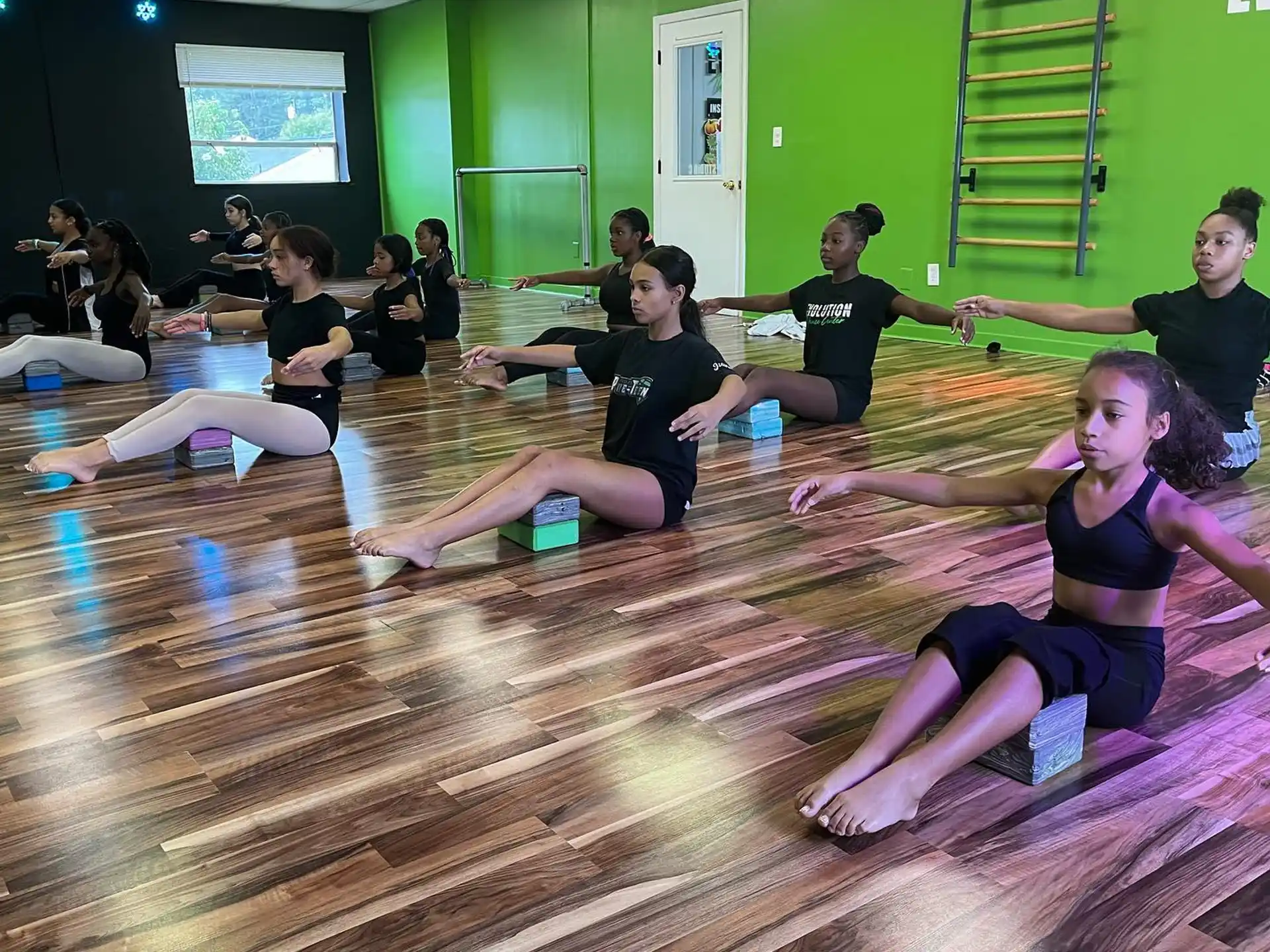 a group of people sitting on the floor