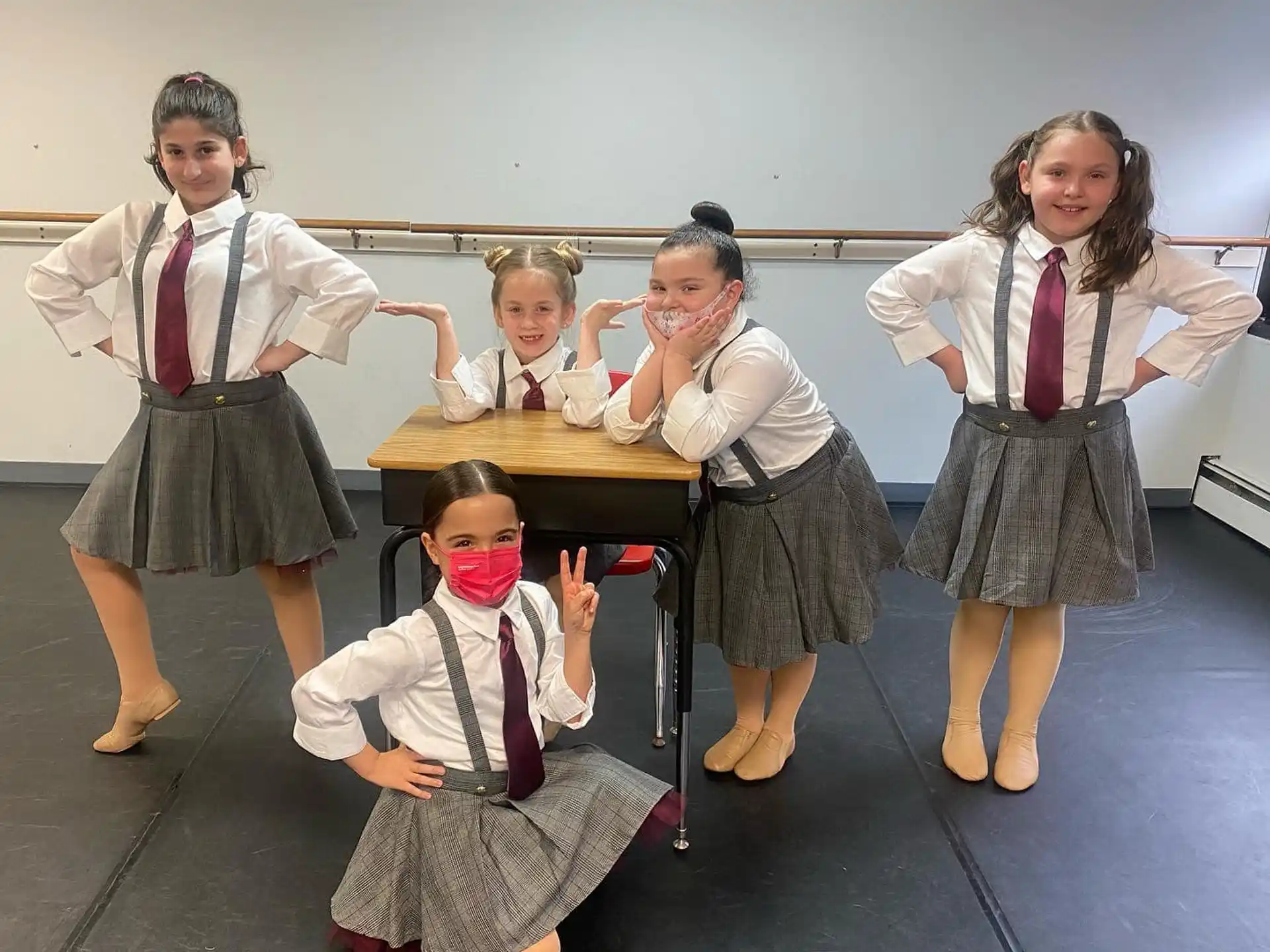 a group of girls in school uniforms
