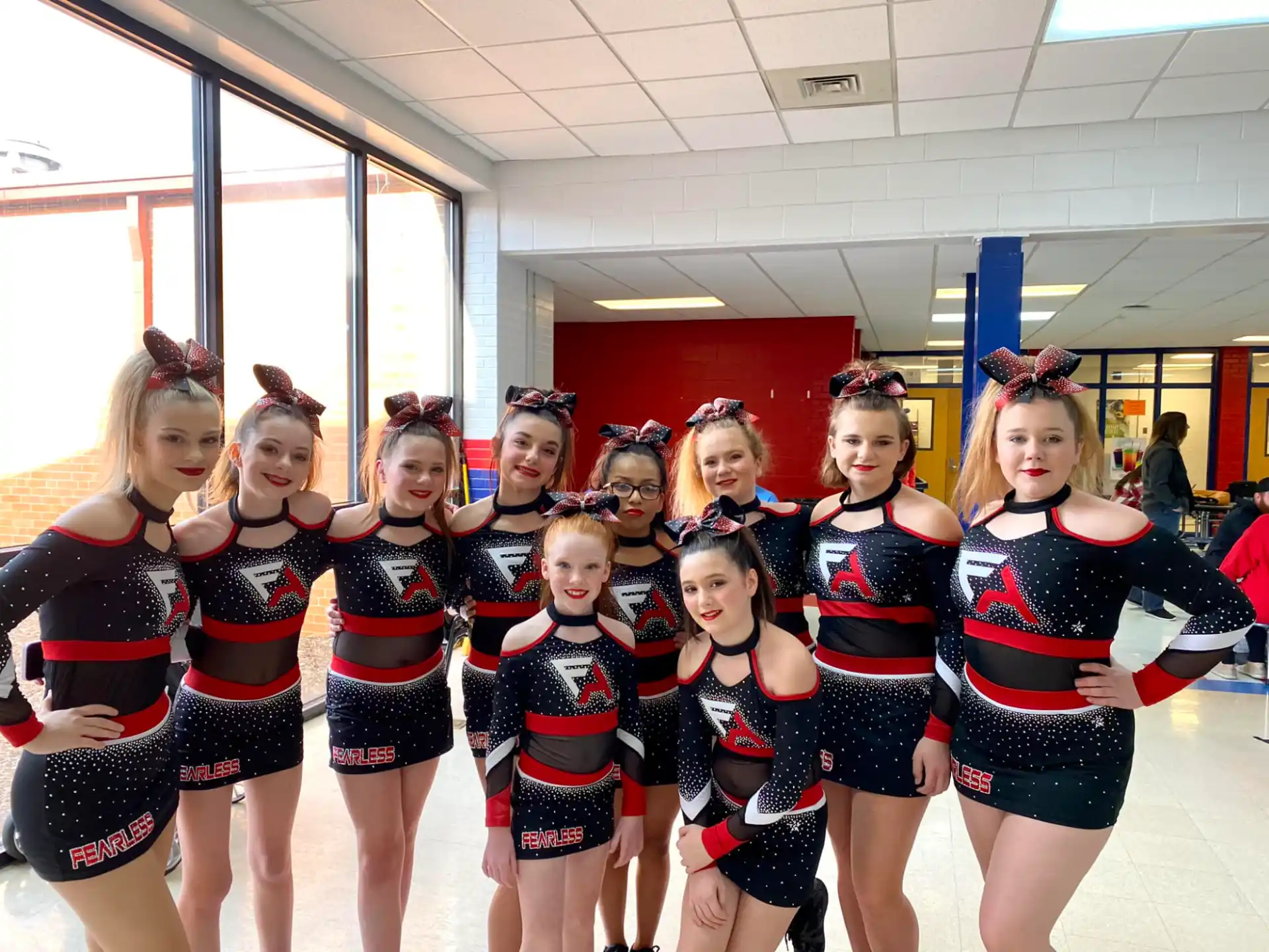 a group of cheerleaders posing for a photo