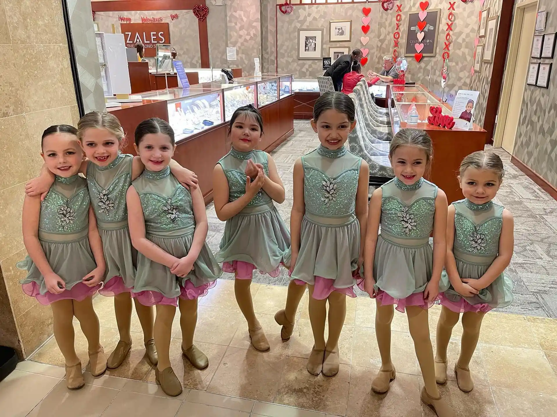 a group of children in dresses