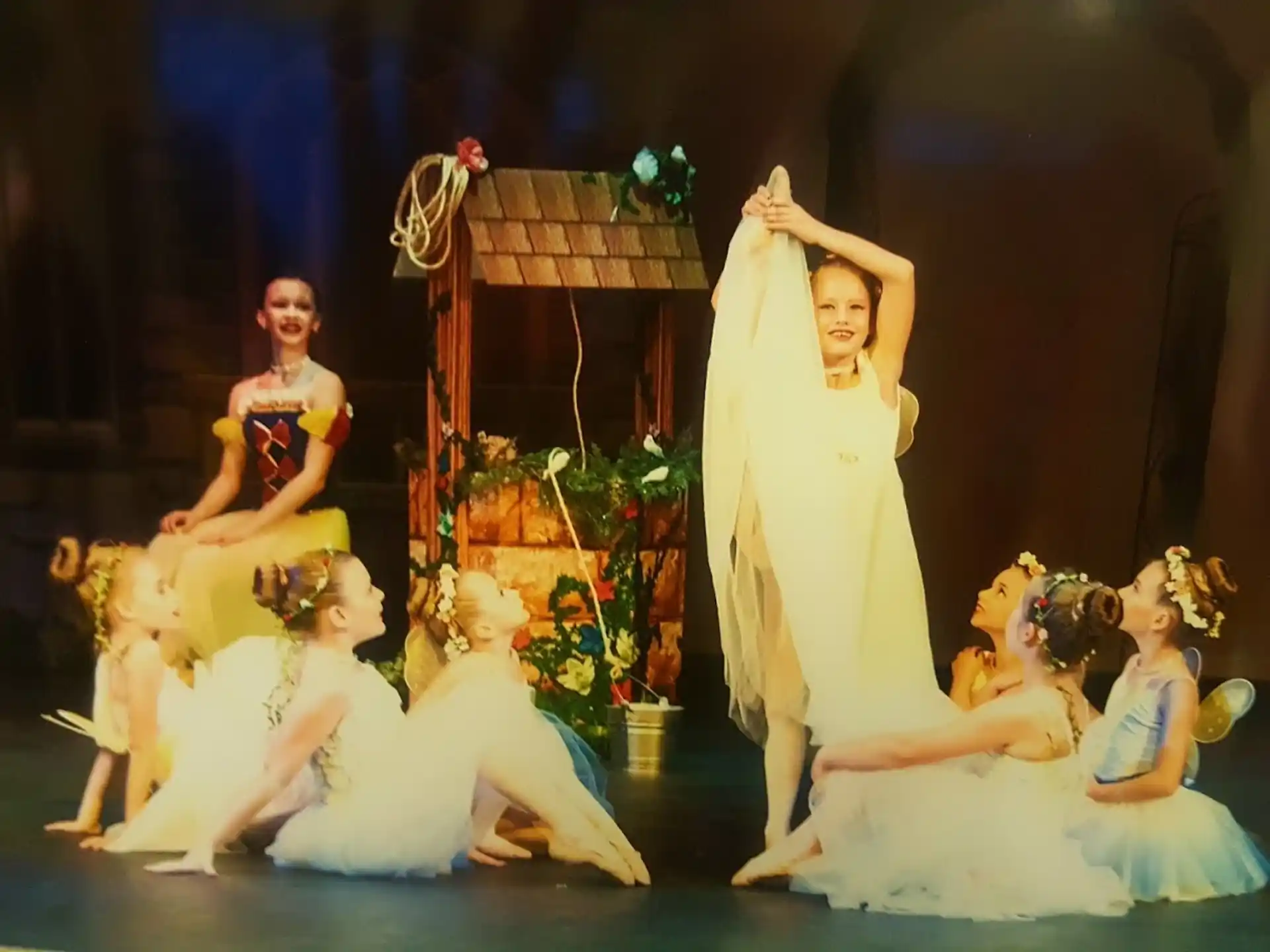 a group of people performing on stage