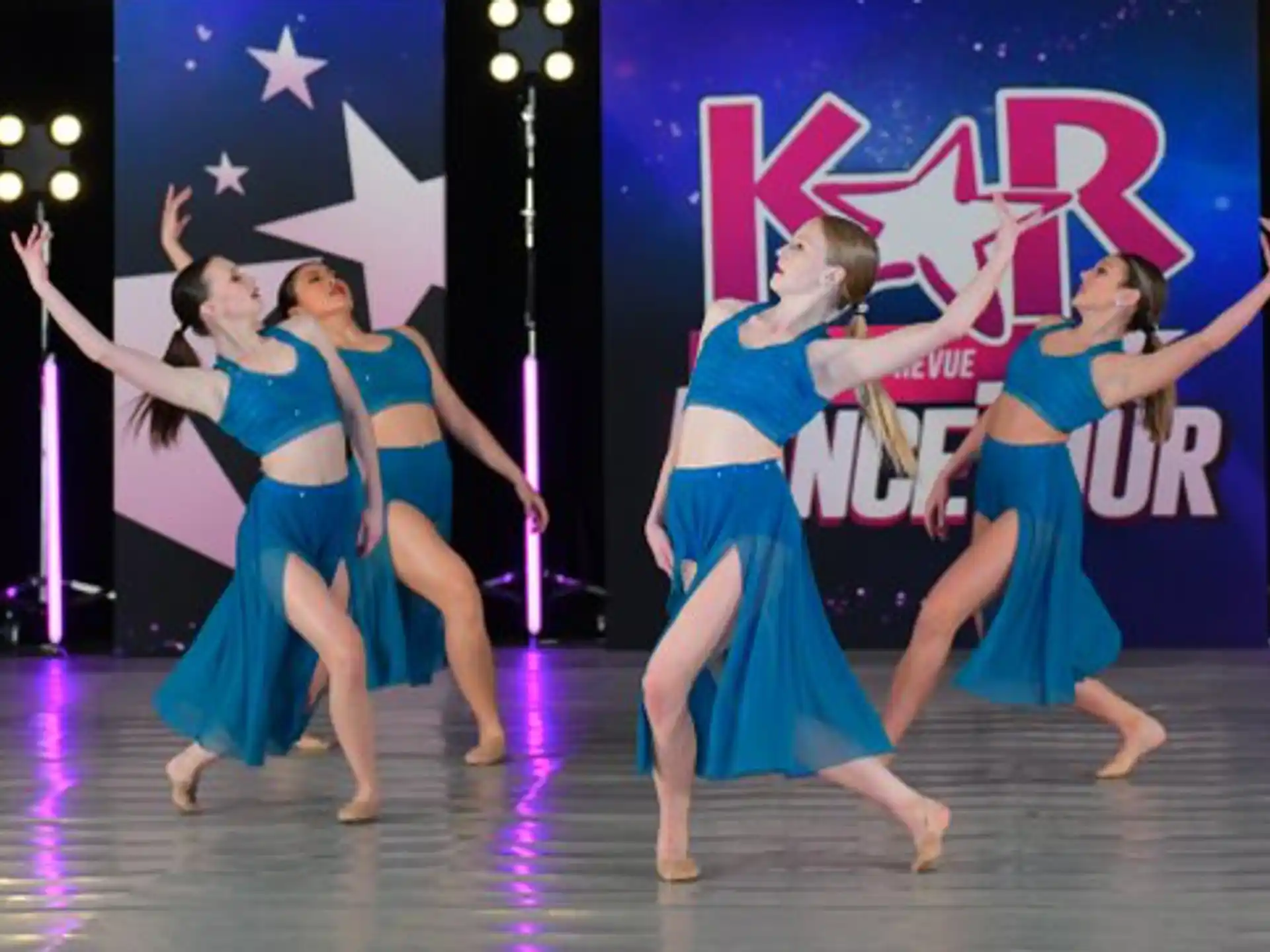 a group of women dancing on a stage