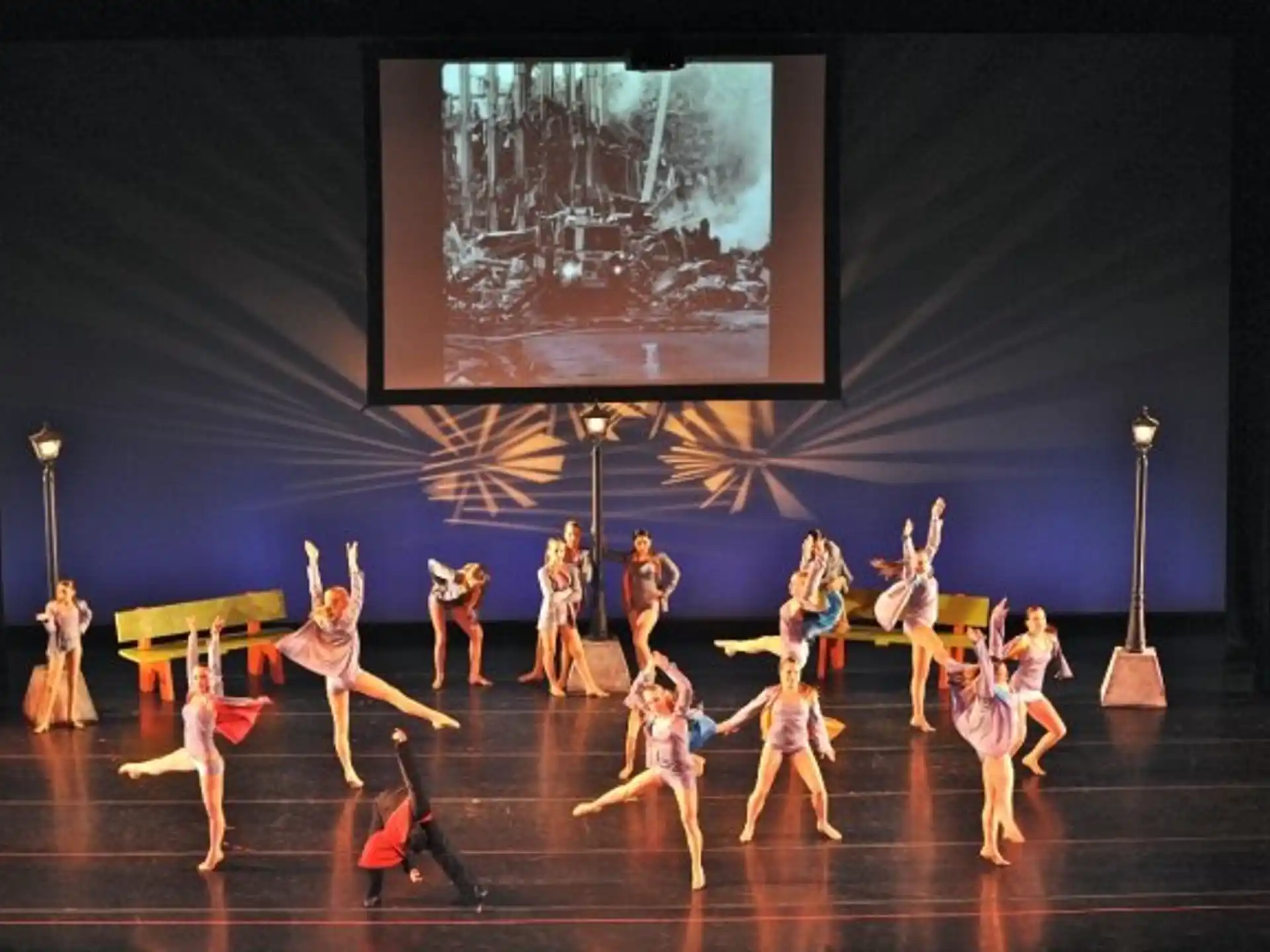 a group of people dancing on a stage