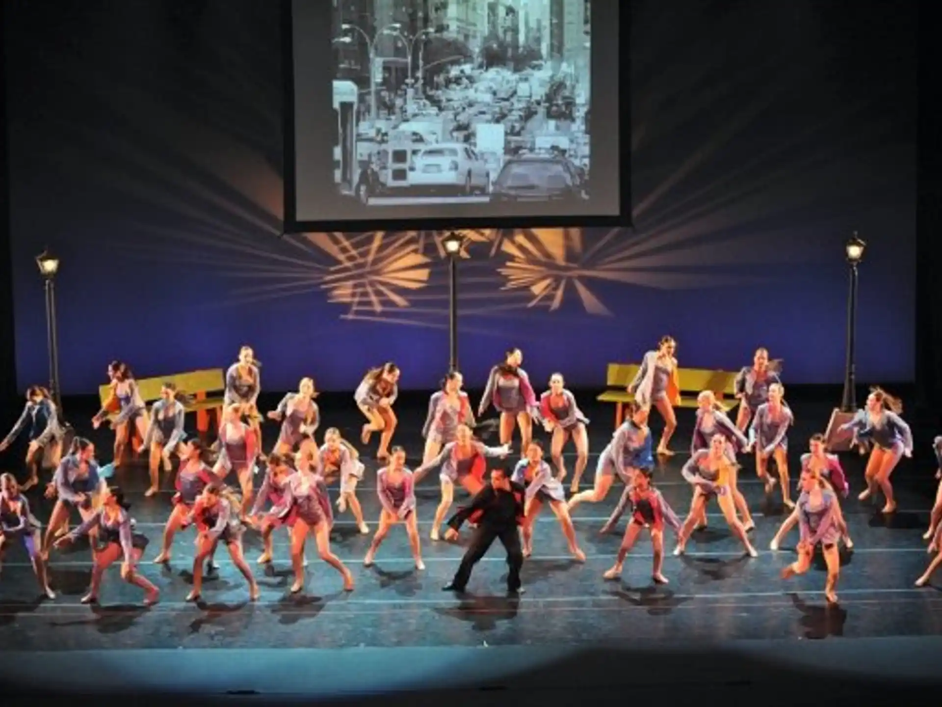 a group of people dancing on a stage