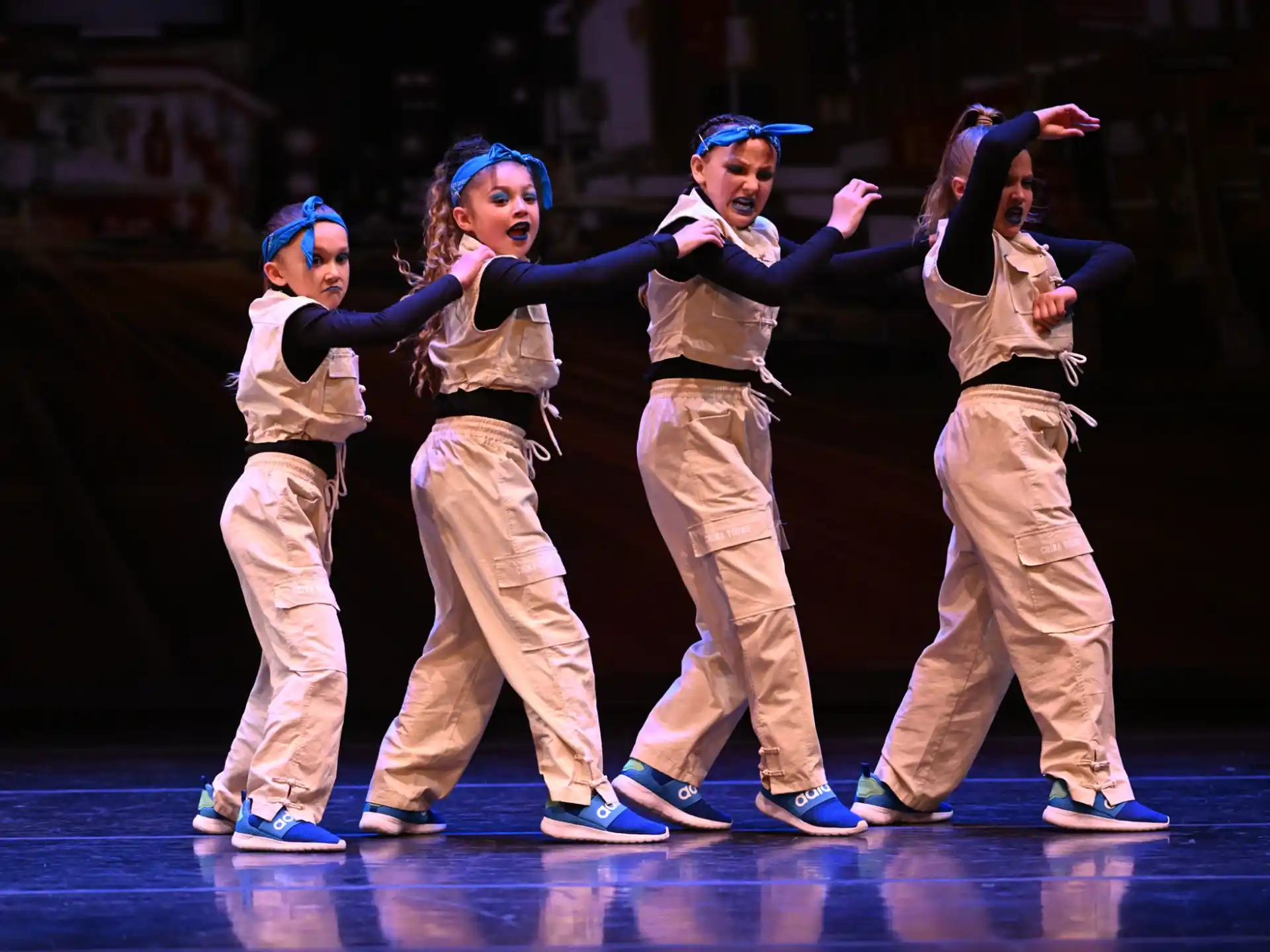 a group of people dancing on a stage