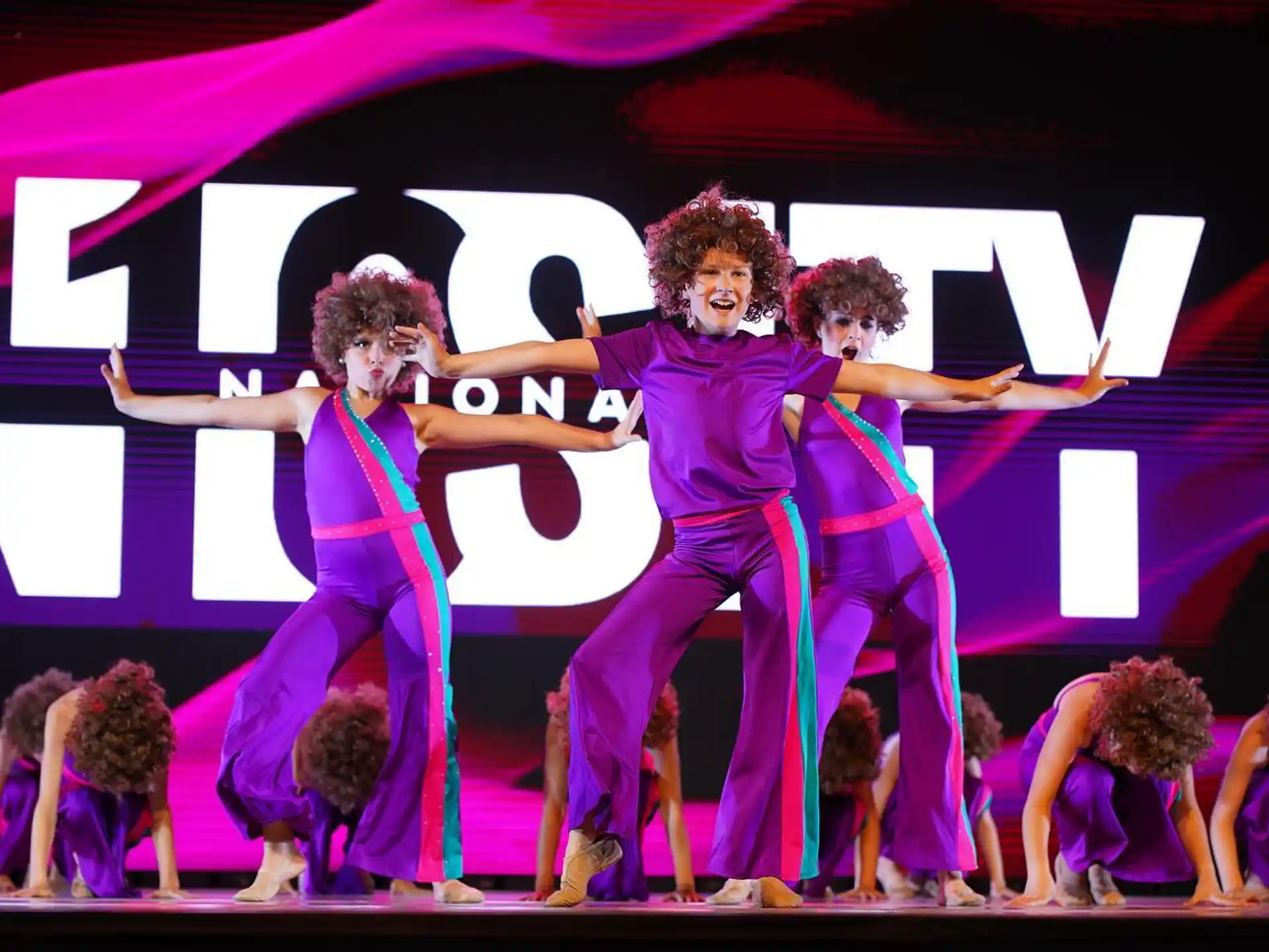 a group of women dancing on a stage