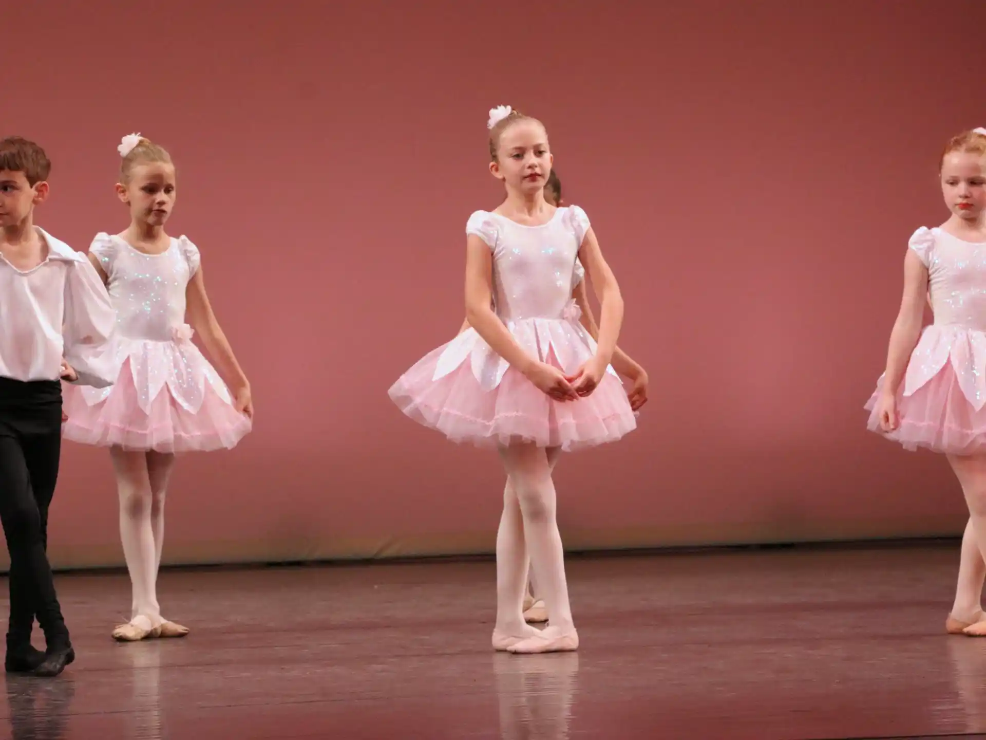 a group of children in dresses