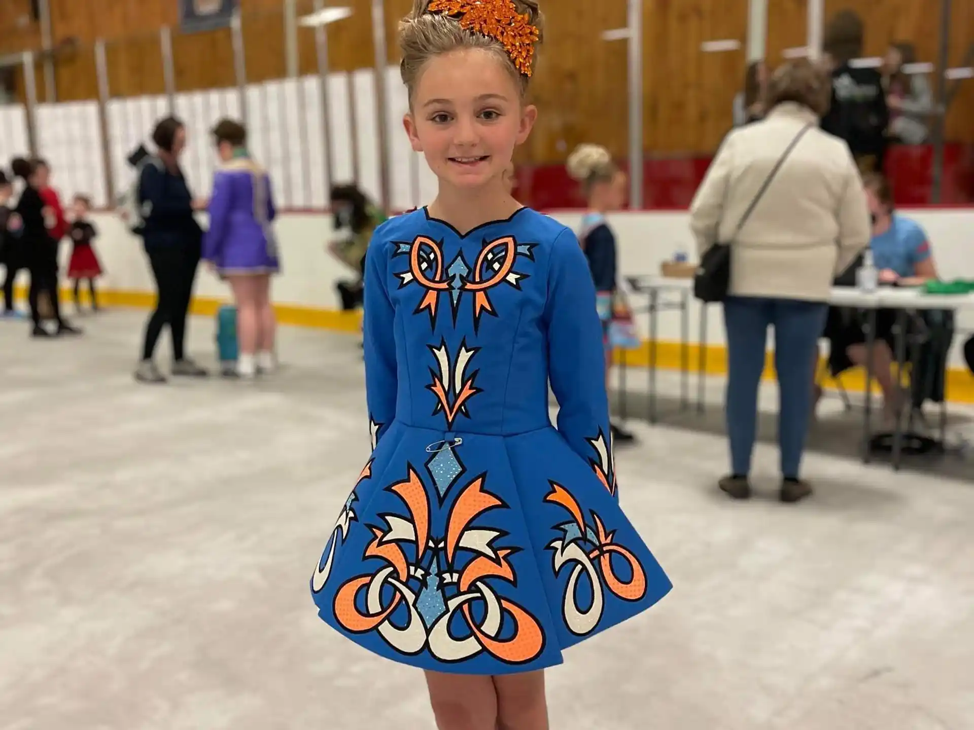 a girl wearing a hockey uniform