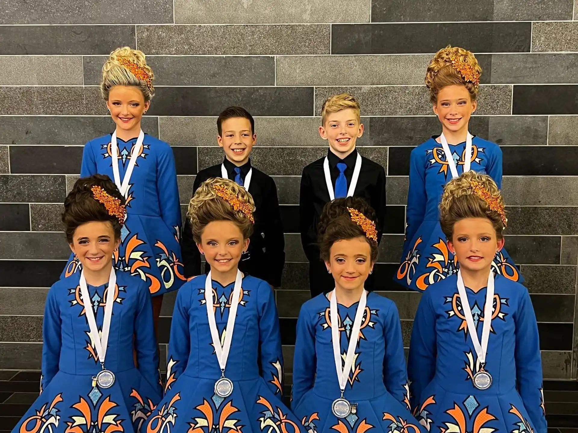 a group of boys in blue uniforms