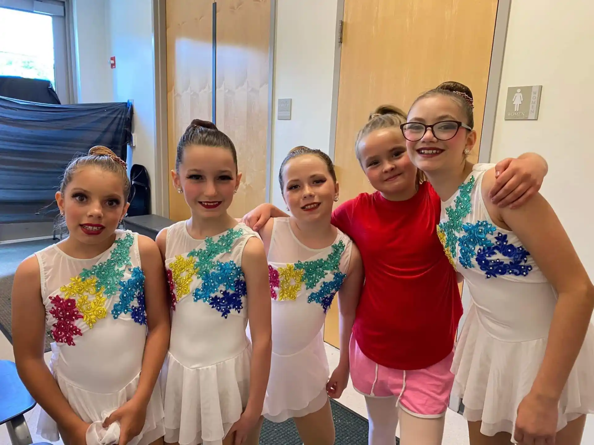 a group of girls posing for a photo