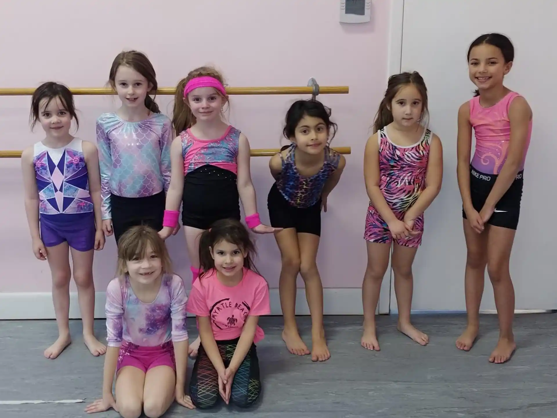 a group of girls posing for a photo