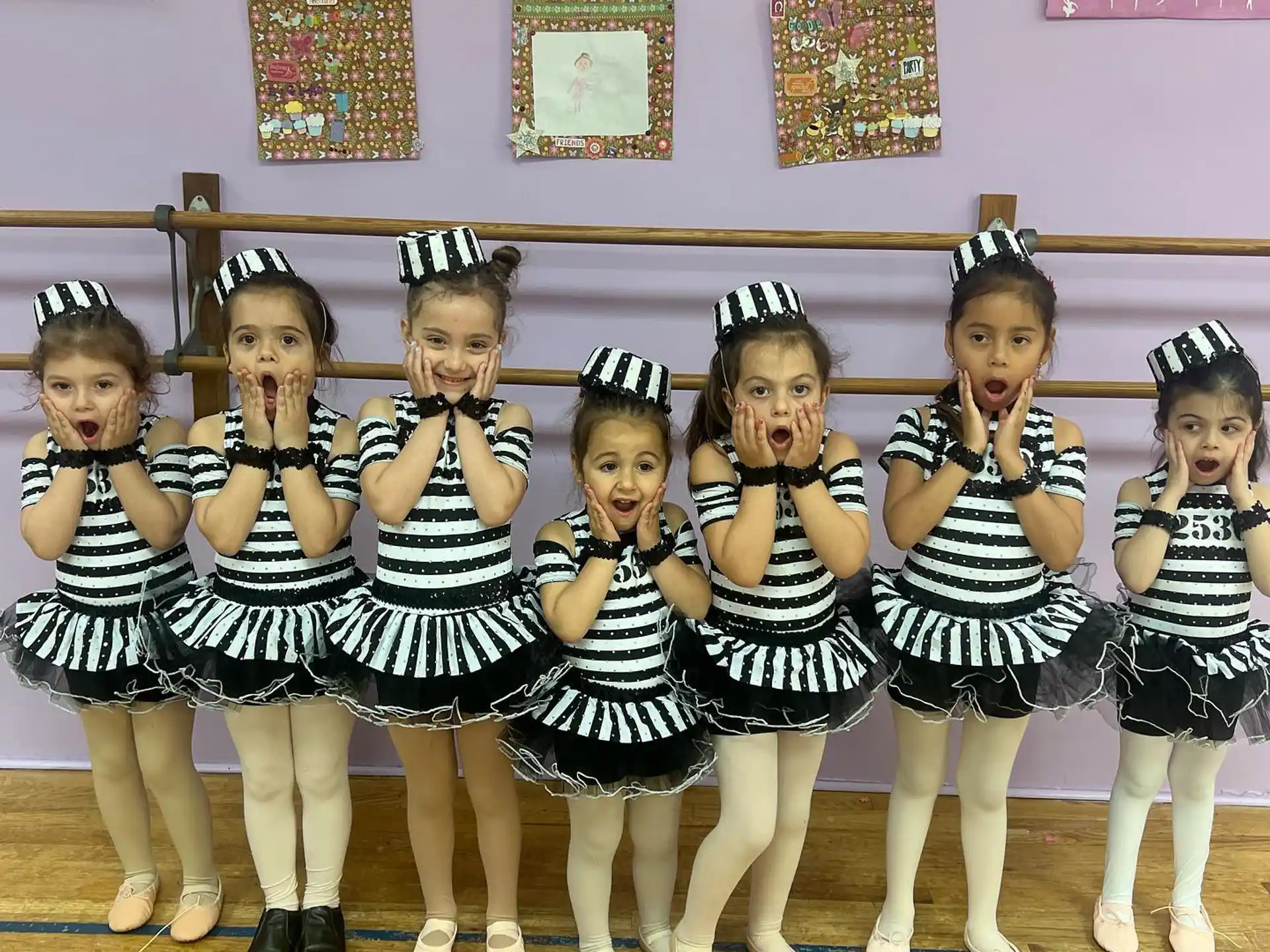 a group of cheerleaders posing for a photo