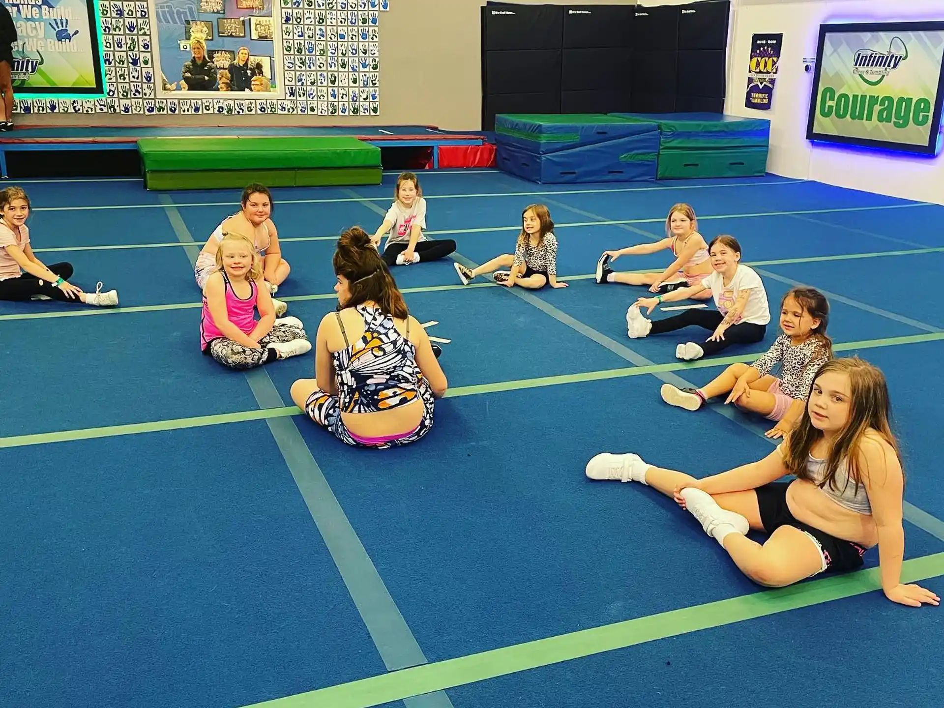 a group of people sitting on the floor