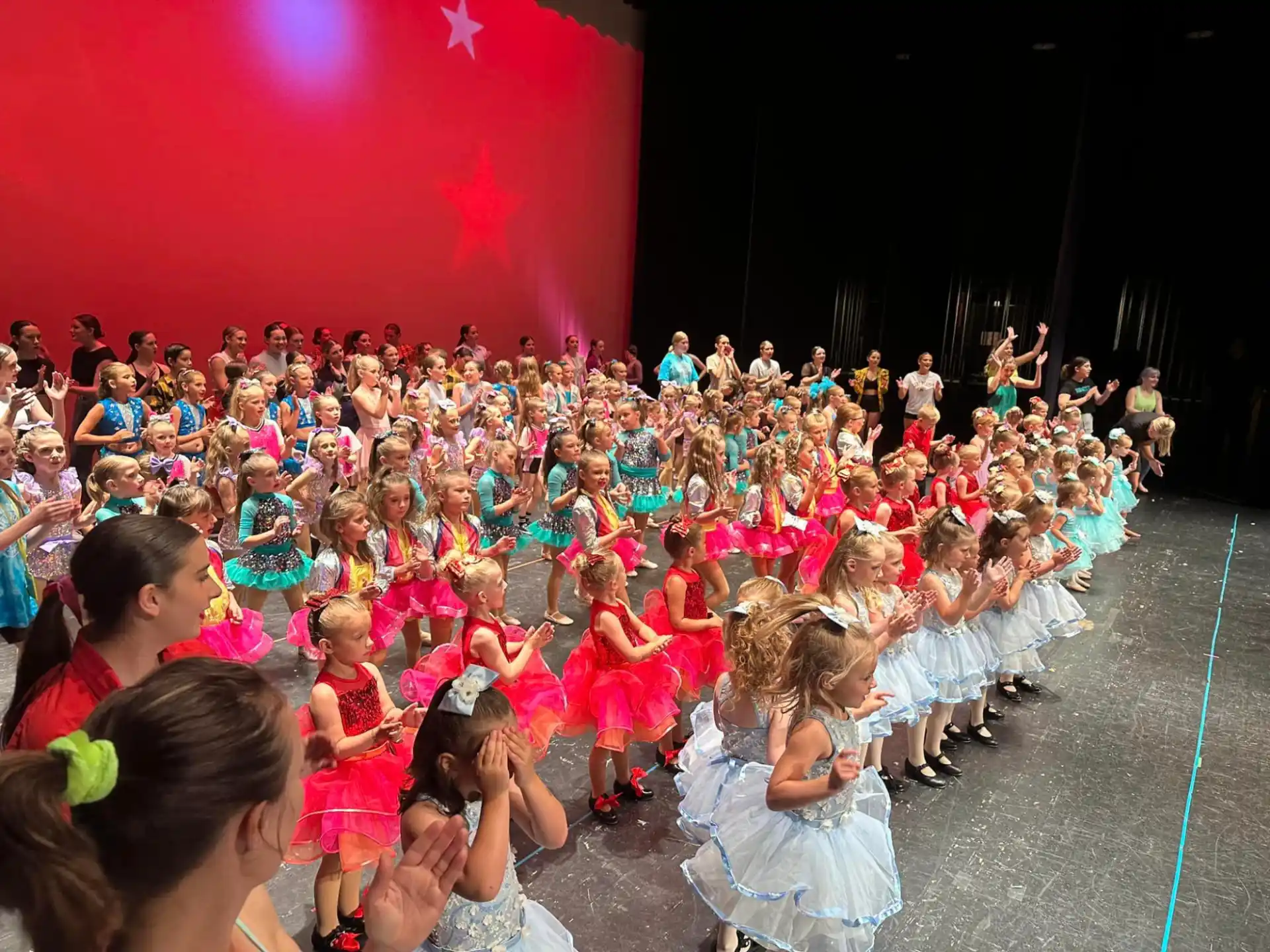 a group of children performing on stage