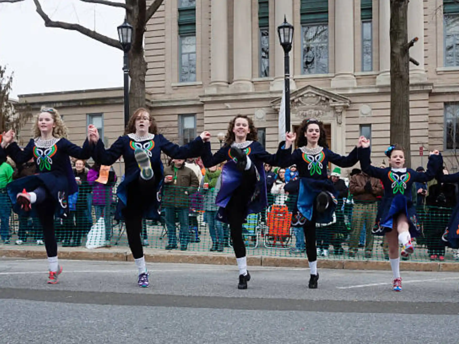 a group of people running on a street