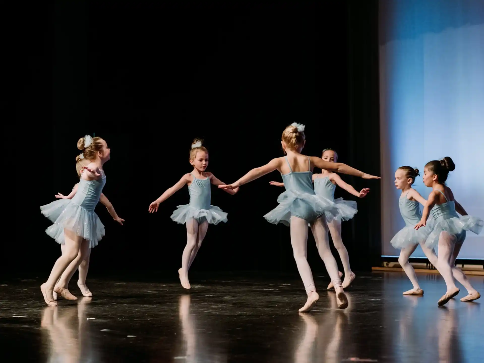 a group of girls dancing on a stage