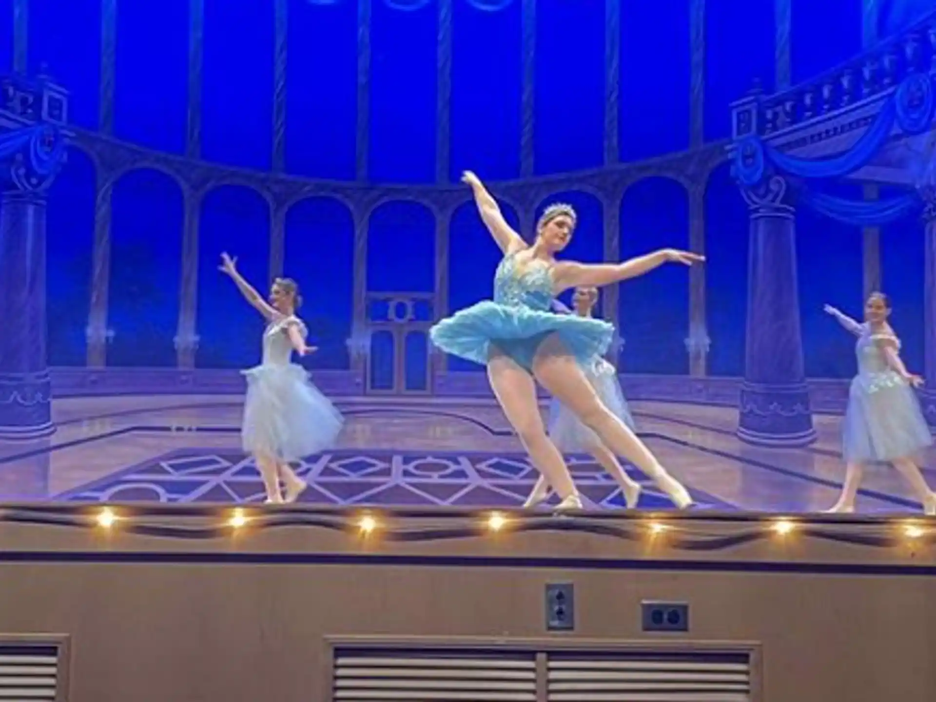 a group of women dancing on a stage