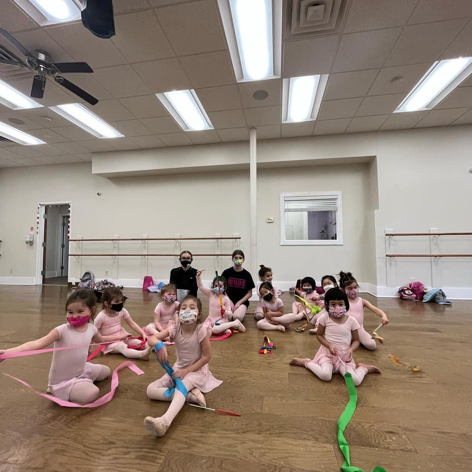 a group of children playing in a room