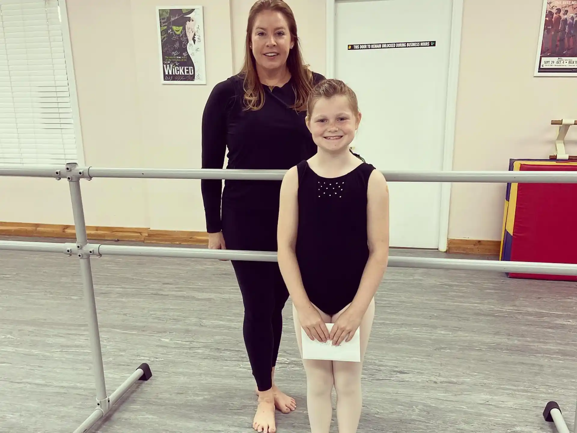 a person and a girl posing for a picture