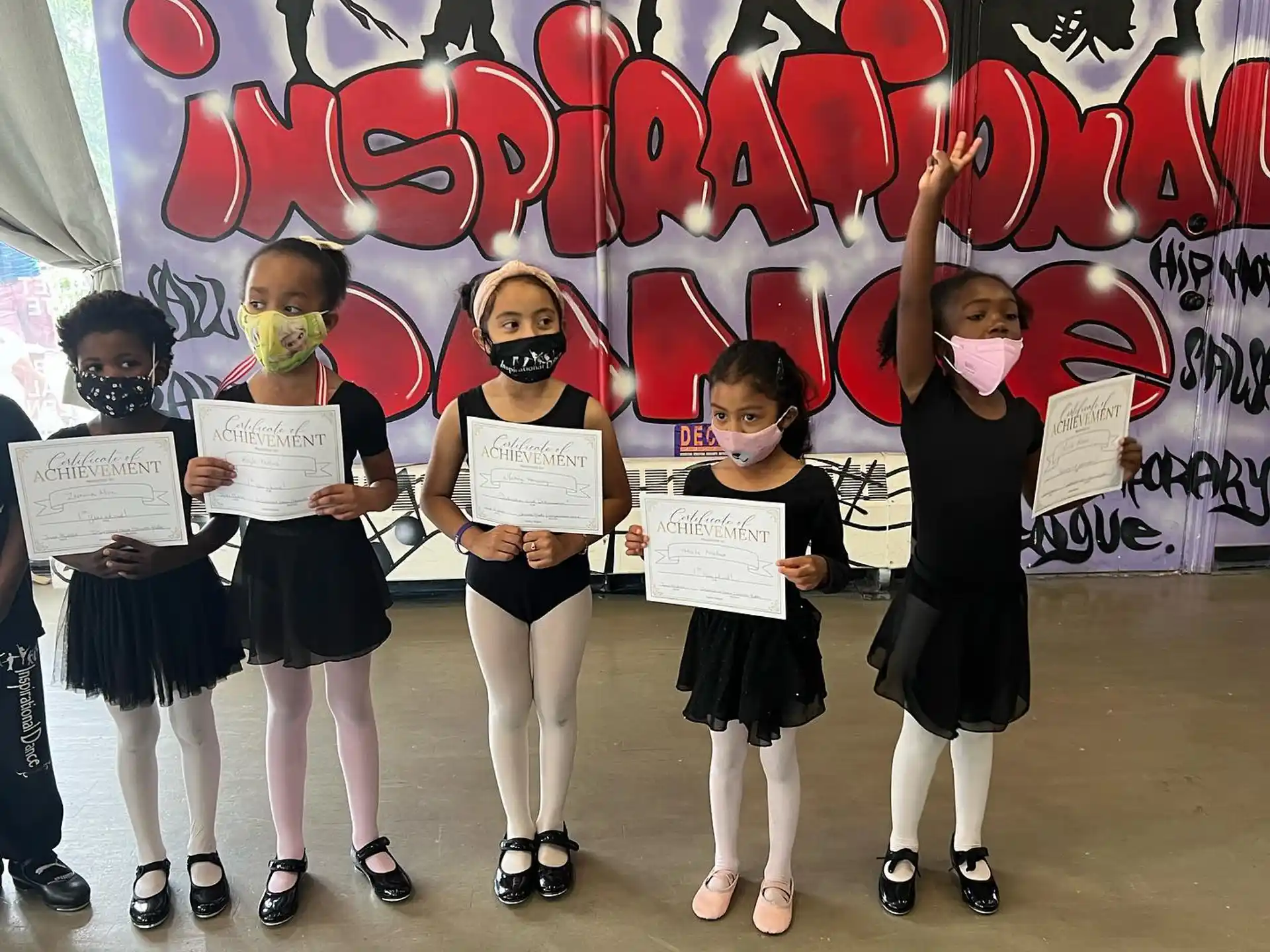 a group of girls holding signs