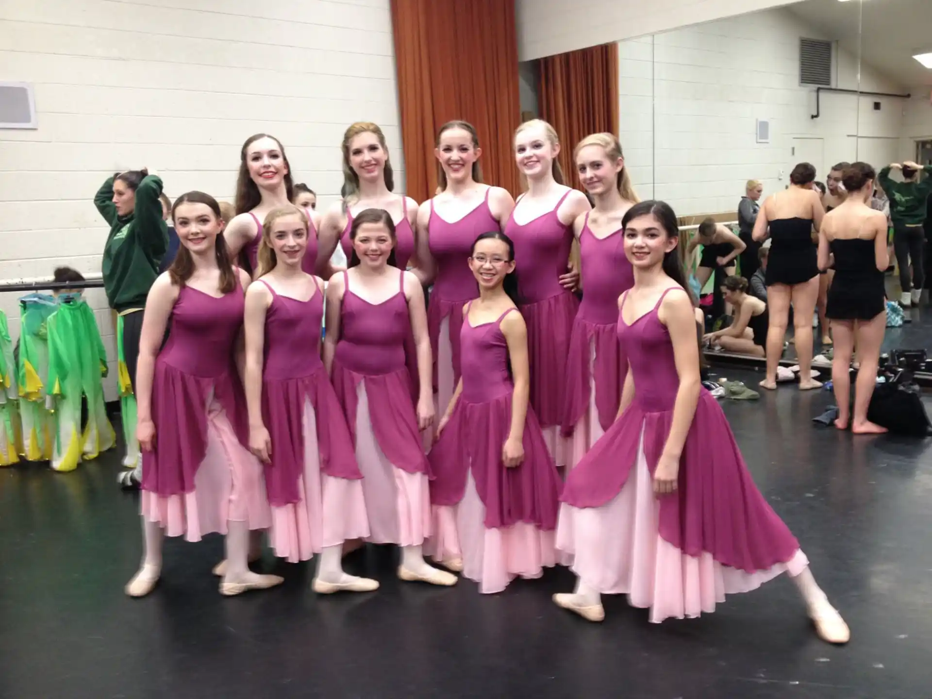 a group of women in dresses