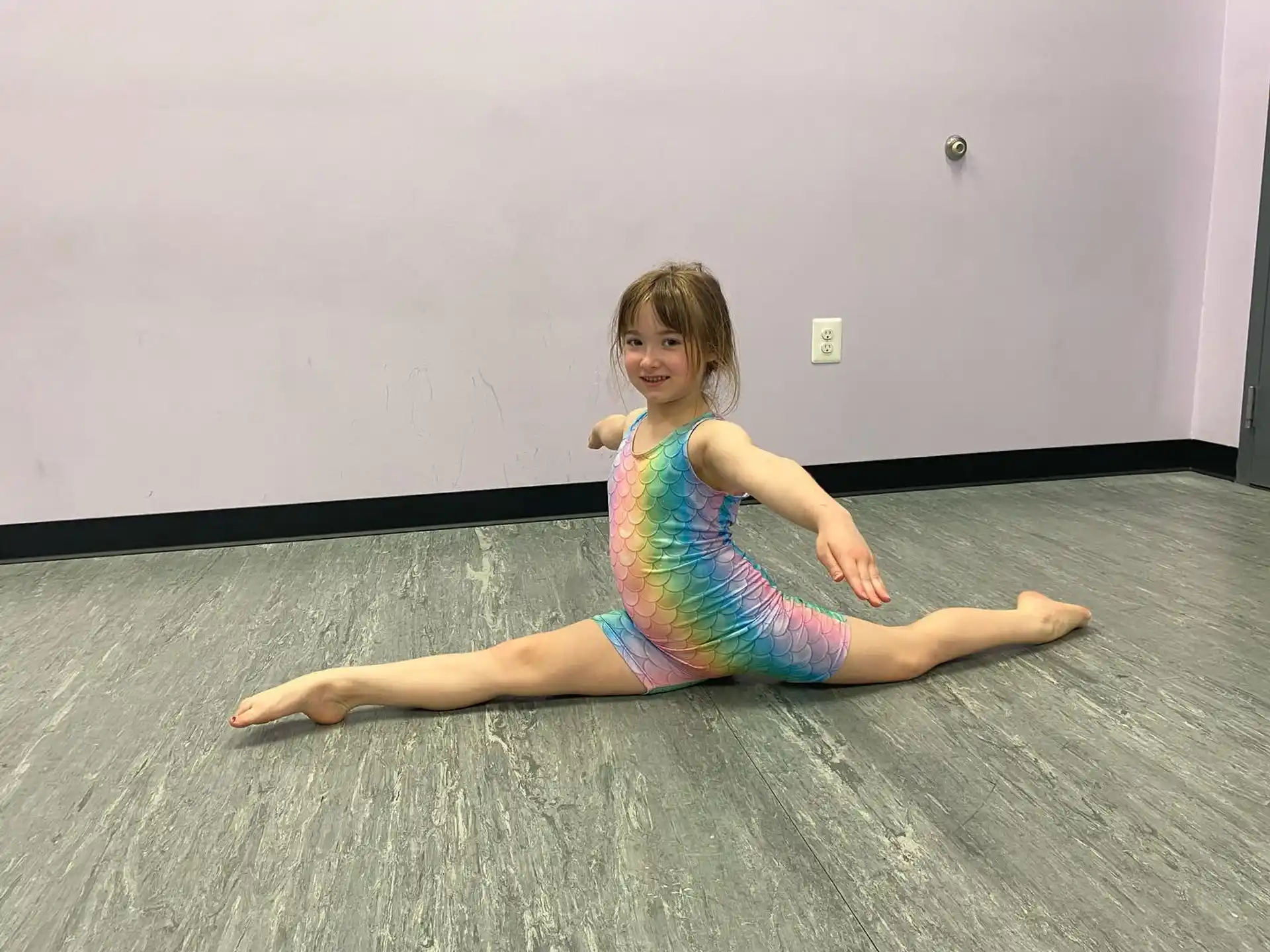 a girl sitting on the floor