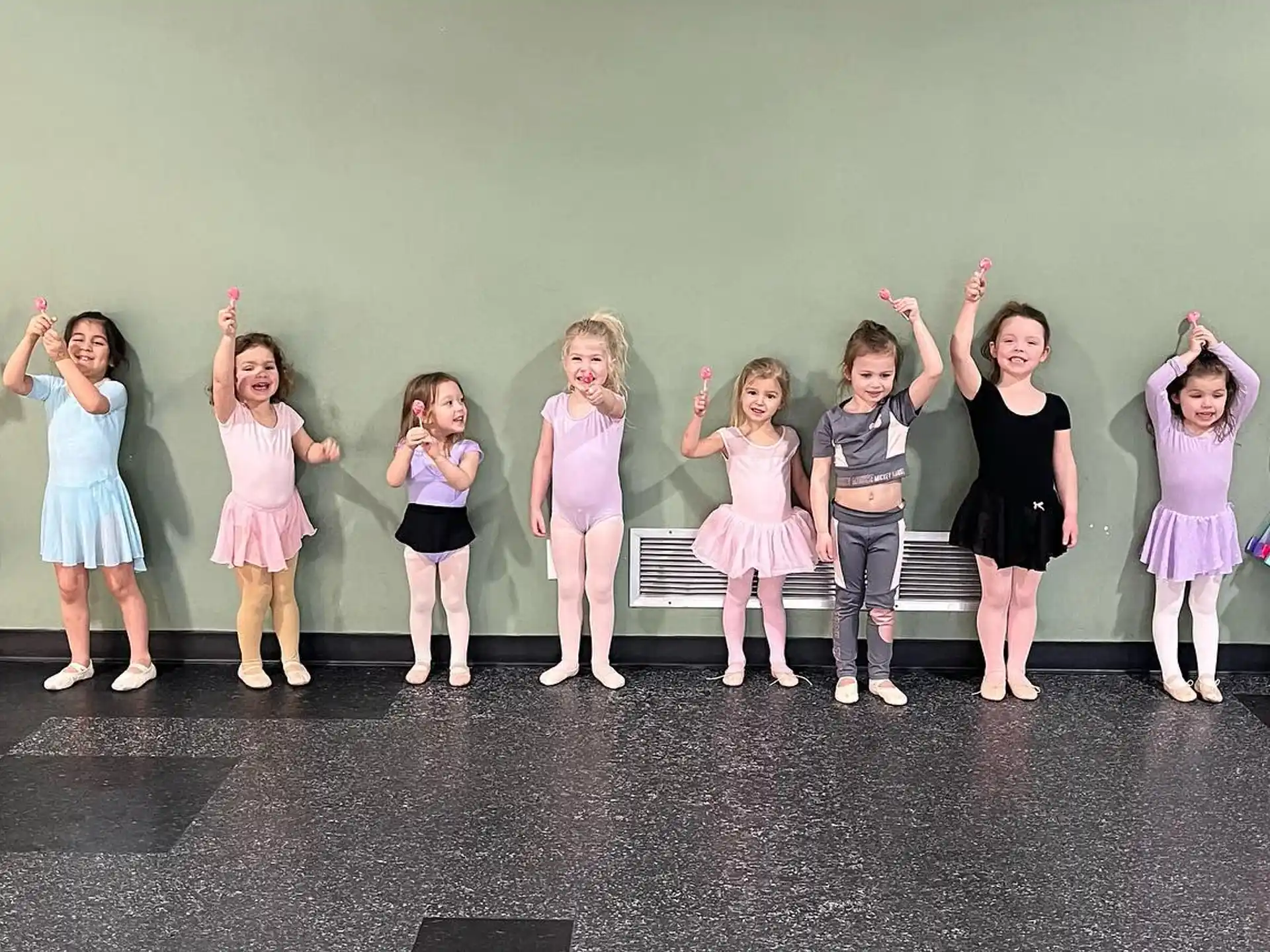 a group of girls posing for a photo
