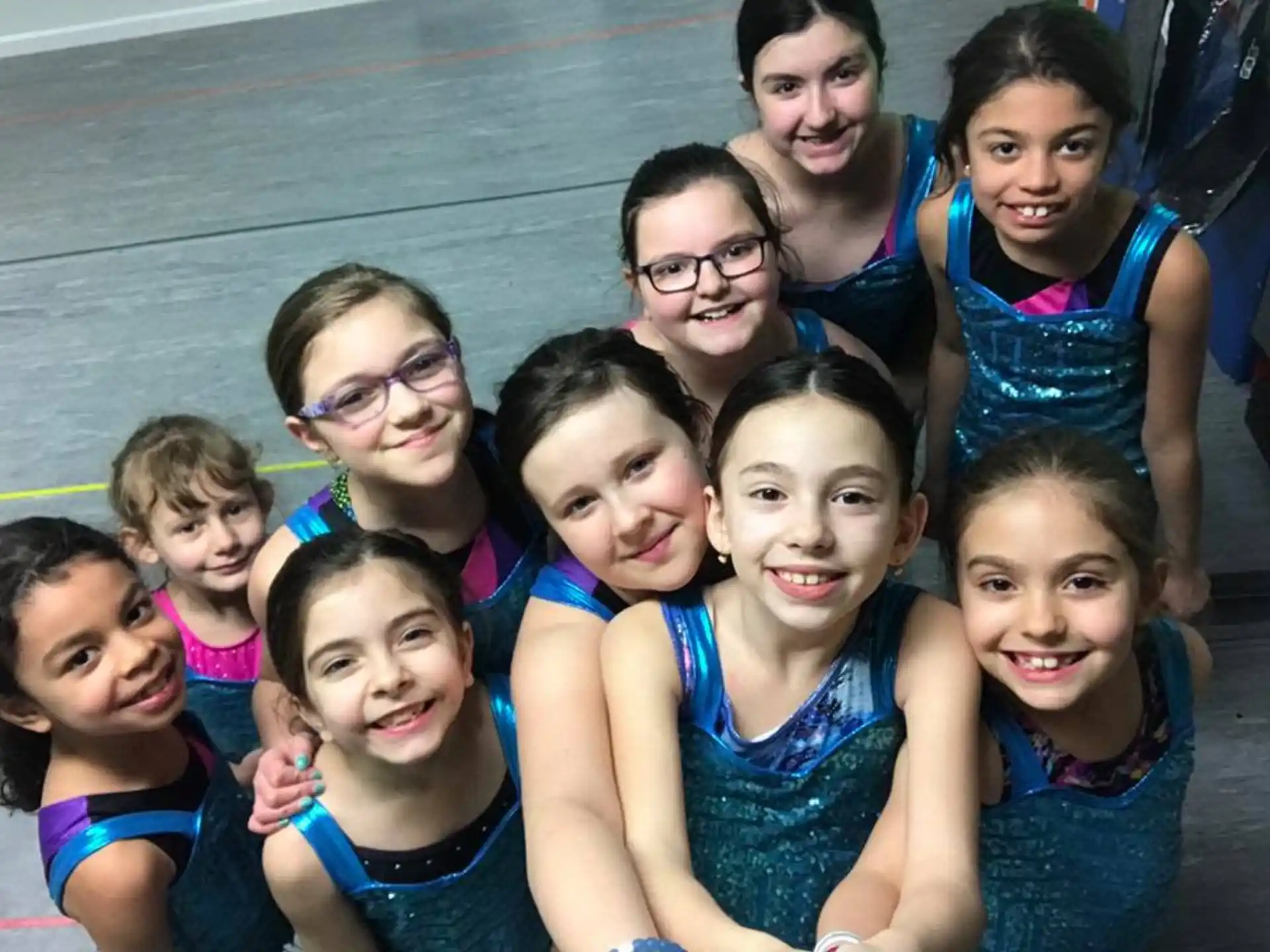 a group of girls posing for a photo
