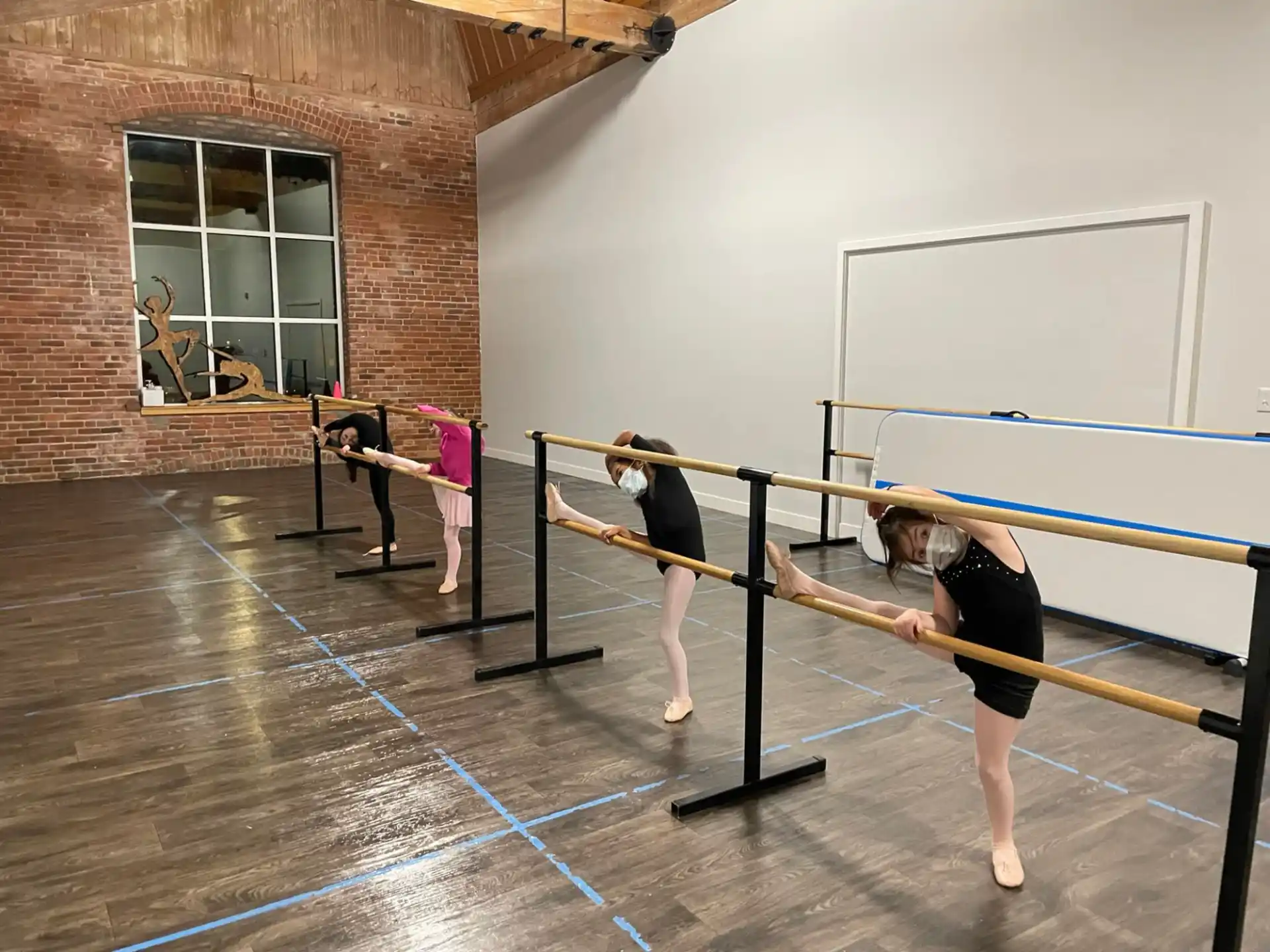 a group of women practicing volleyball