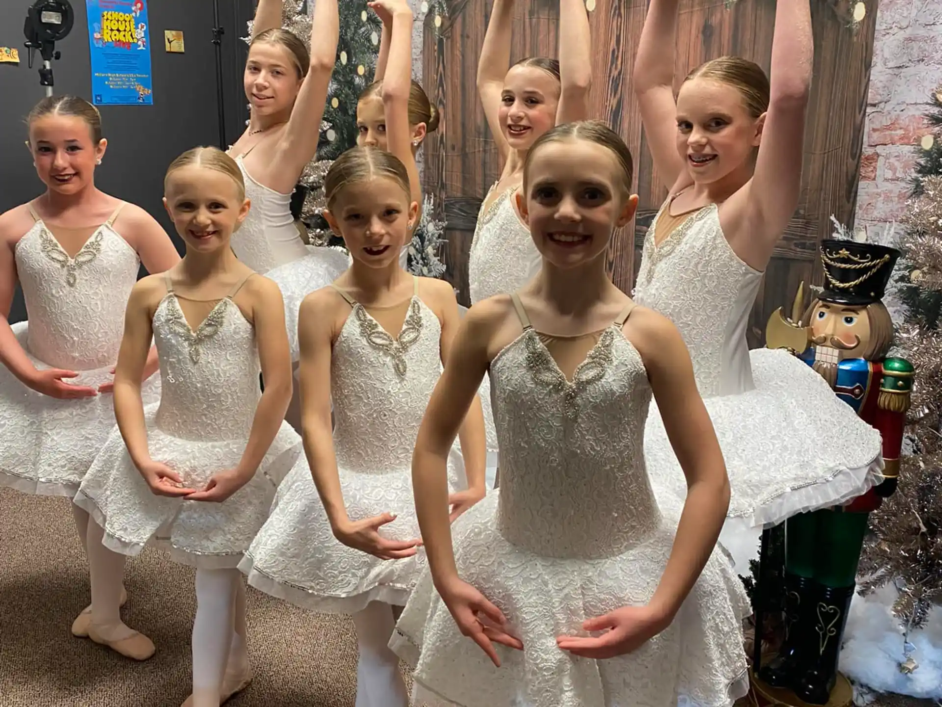 a group of children in white dresses