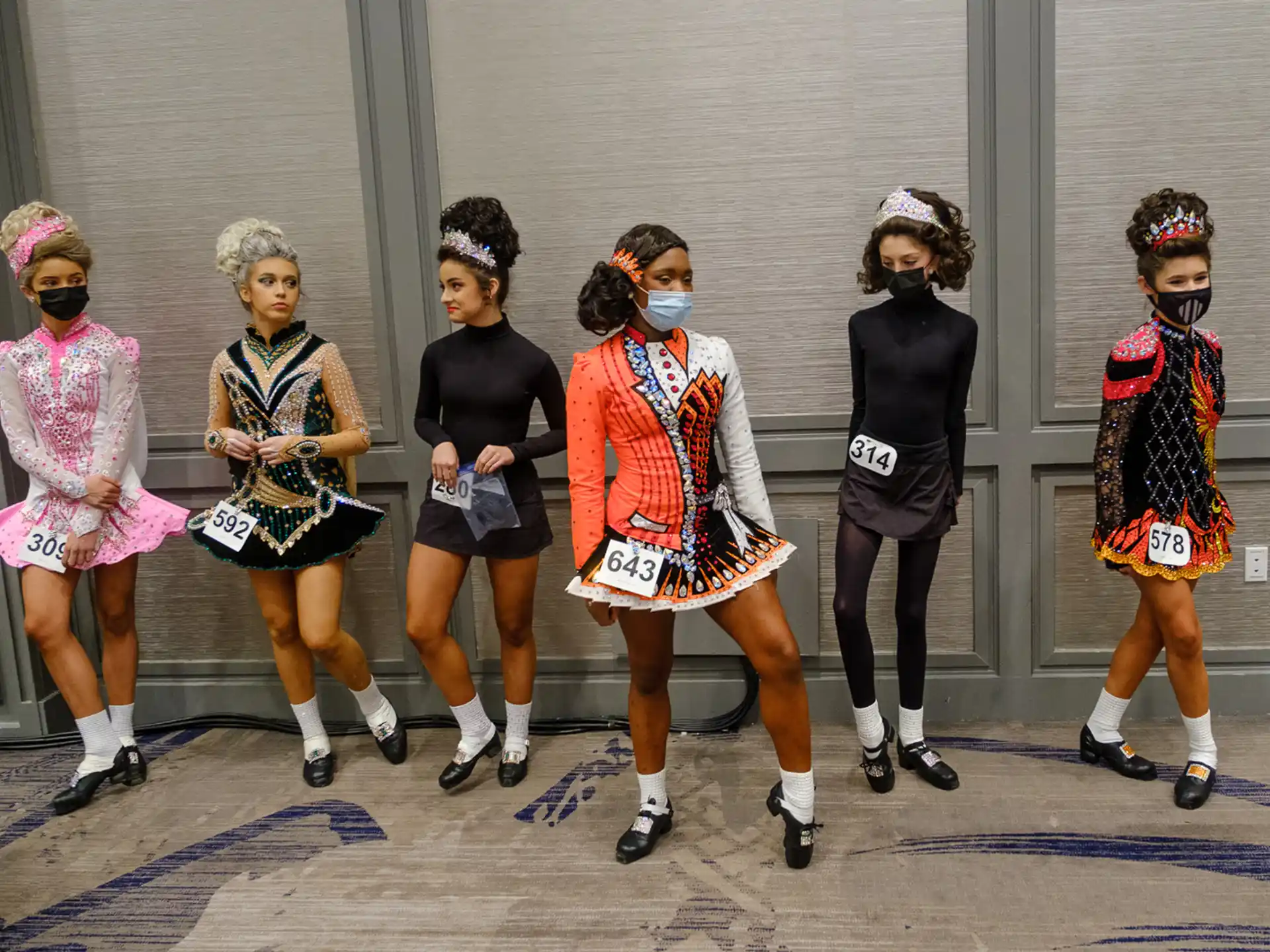 a group of women wearing clothing