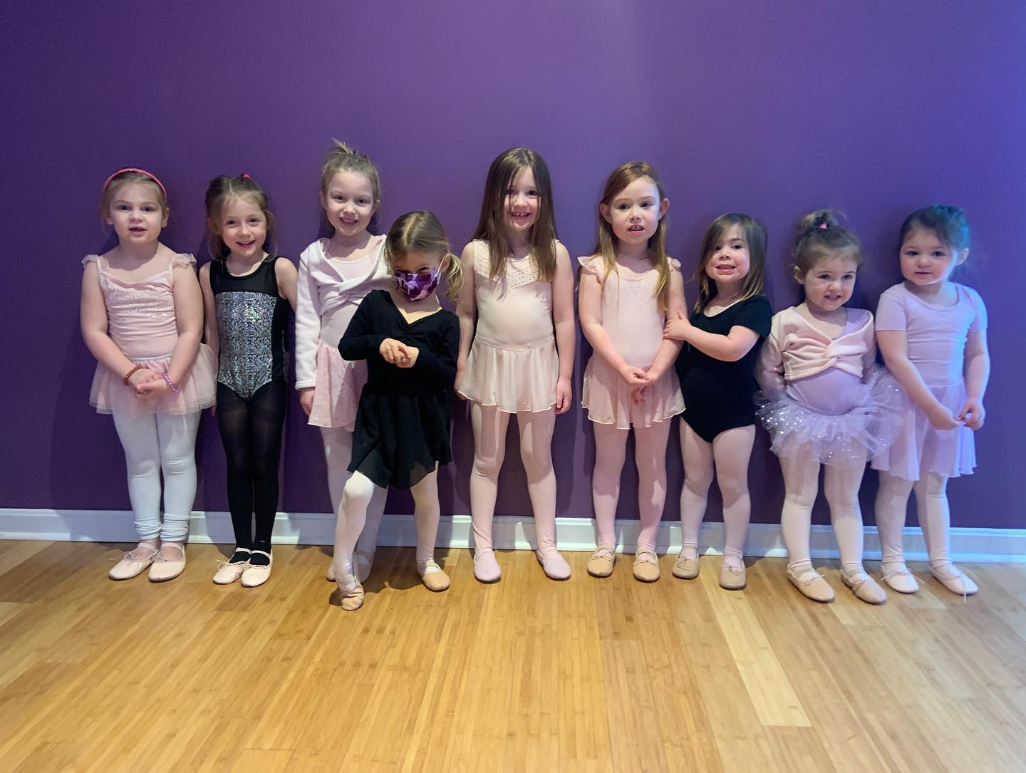 a group of girls posing for a photo