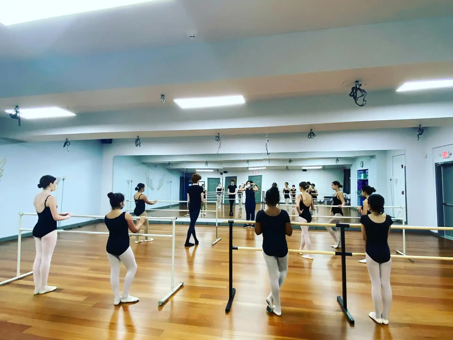 a group of people exercising in a gym