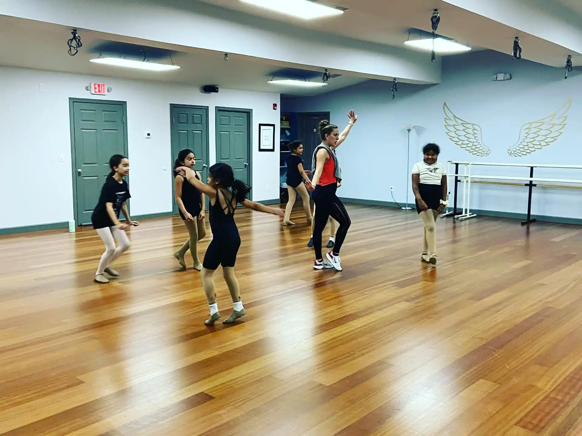 a group of people exercising in a gym