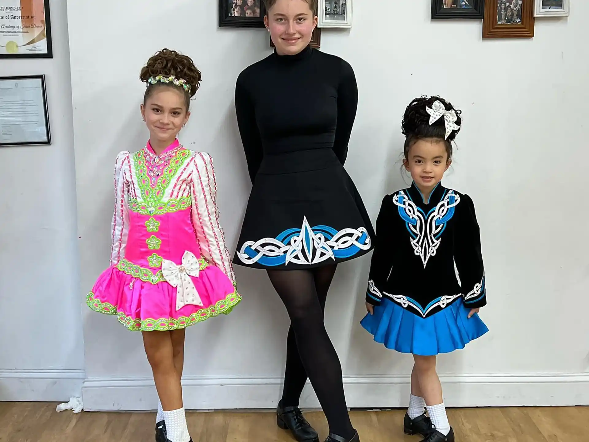 a person and two girls in clothing