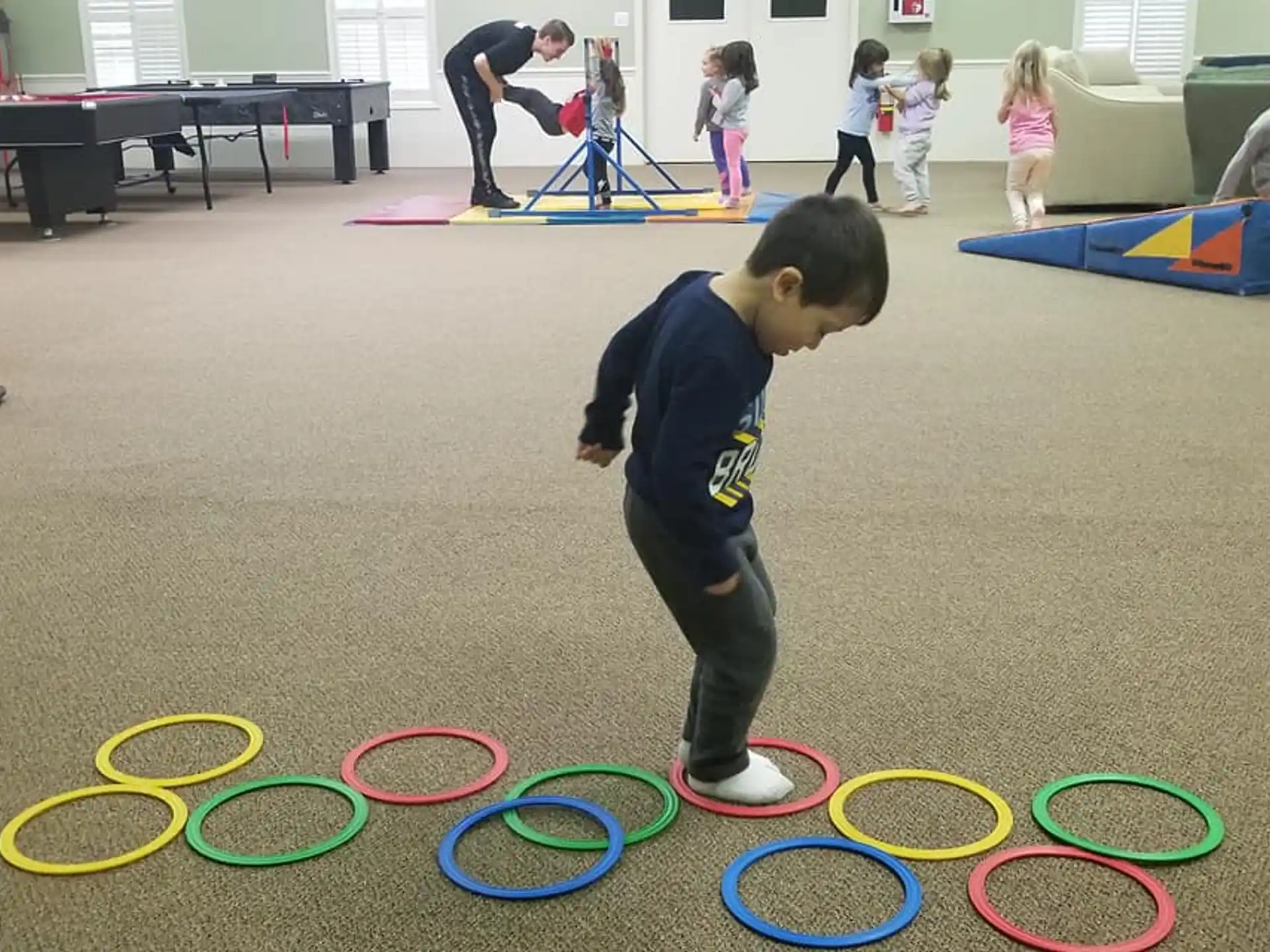 a group of children playing in a room