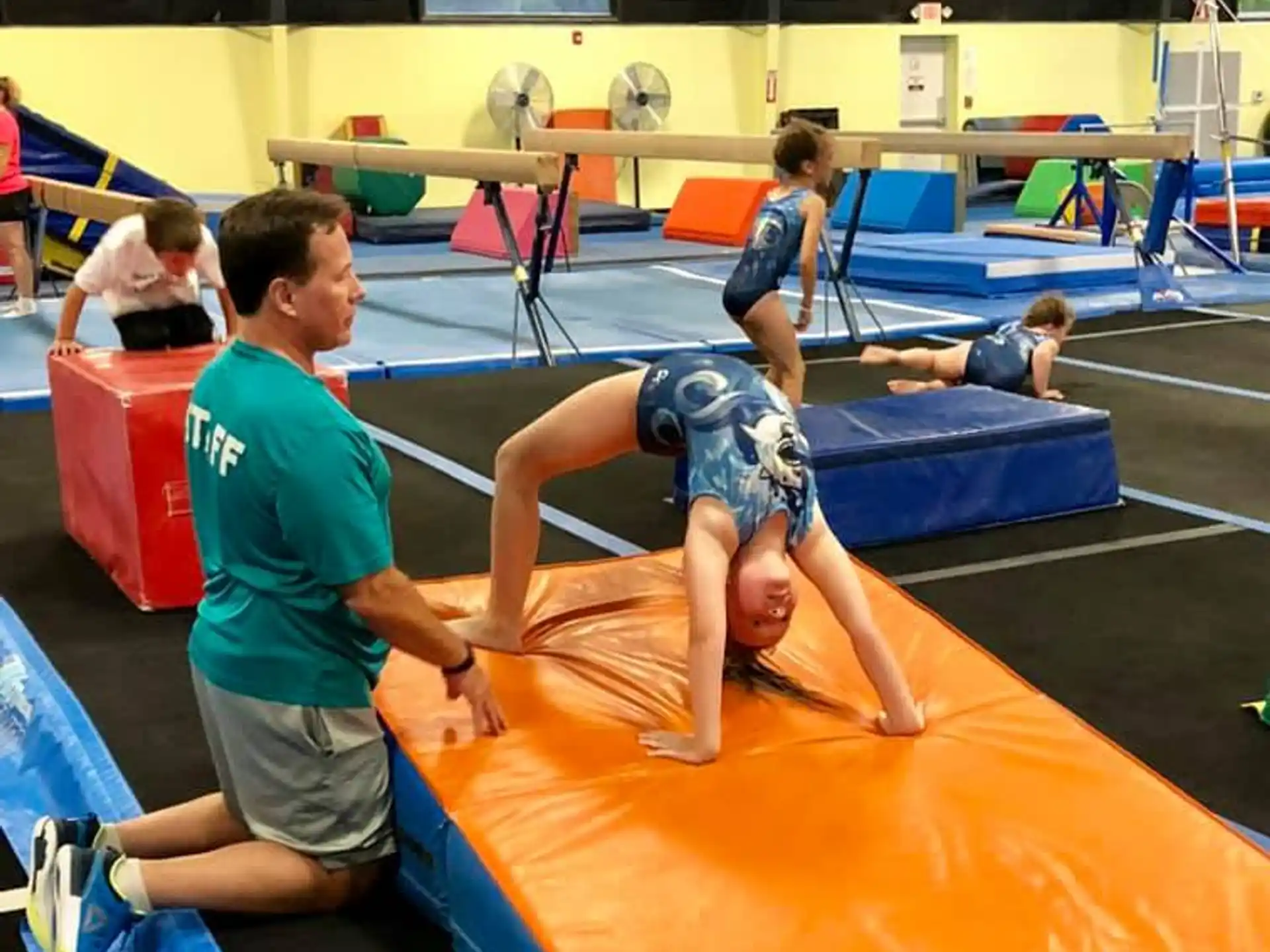 a group of people in a gym