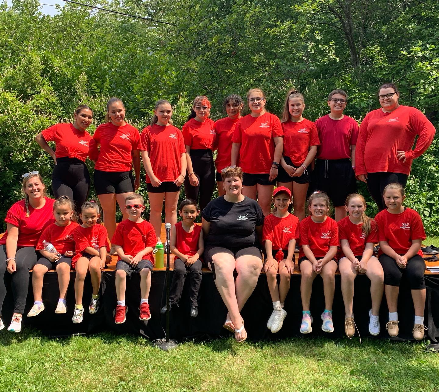 a group of people in red shirts