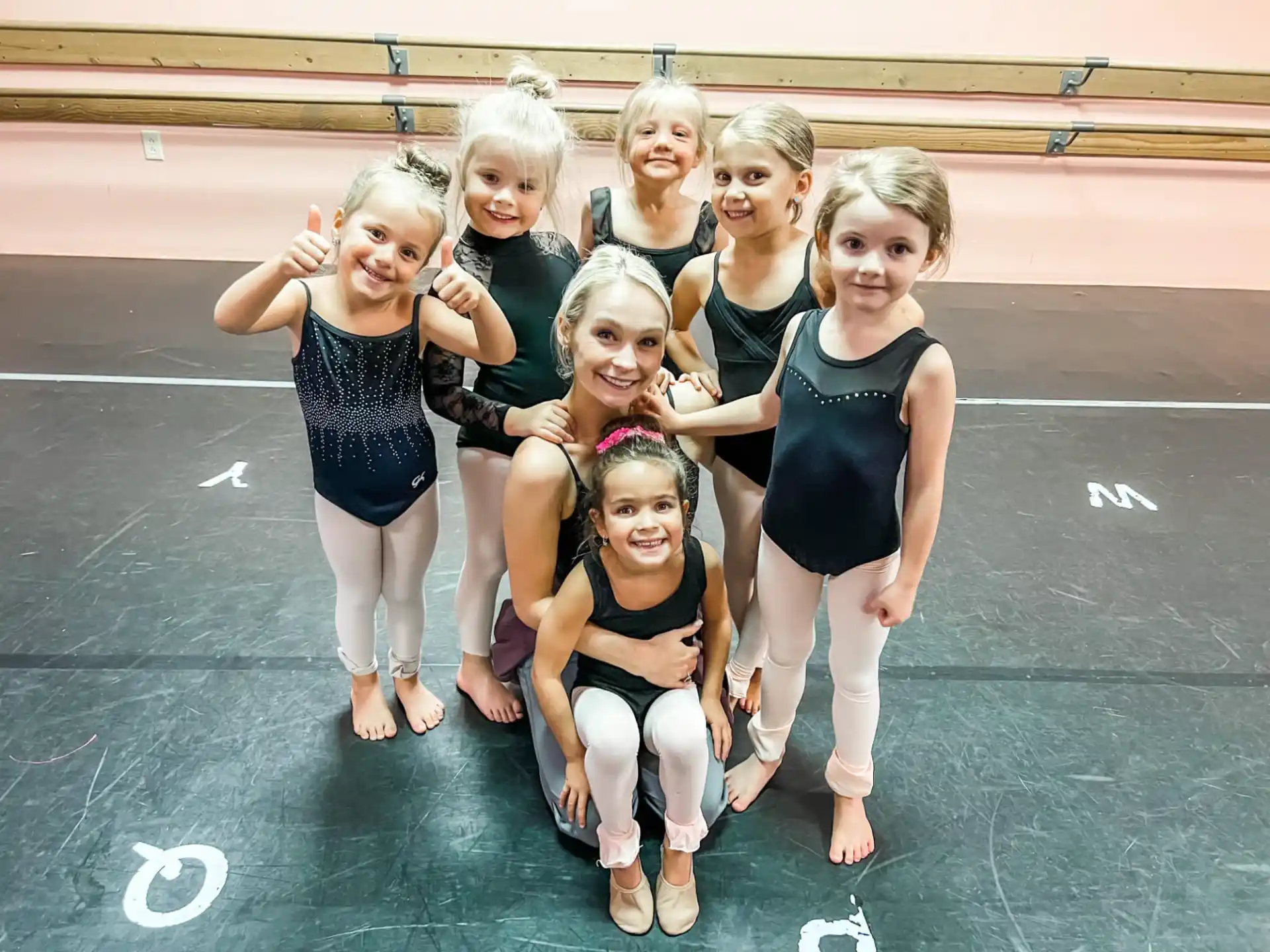 a group of girls posing for a photo