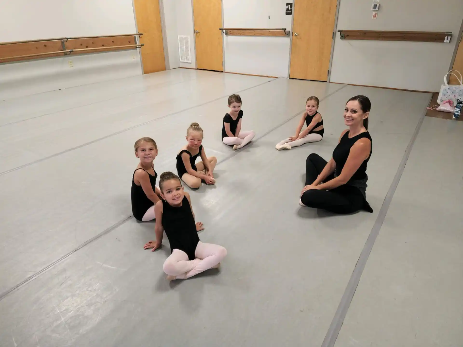 a group of women sitting on the floor