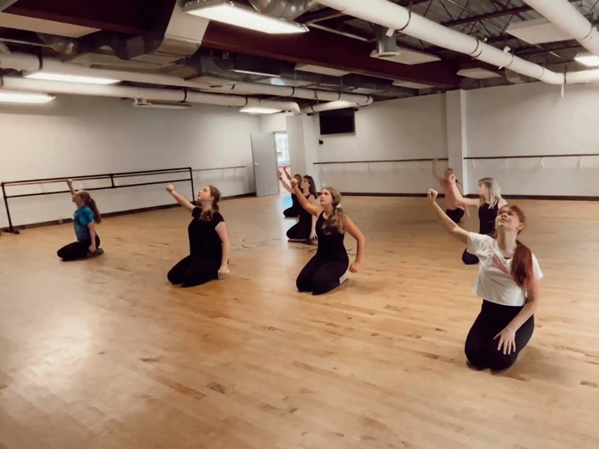 a group of women dancing in a room