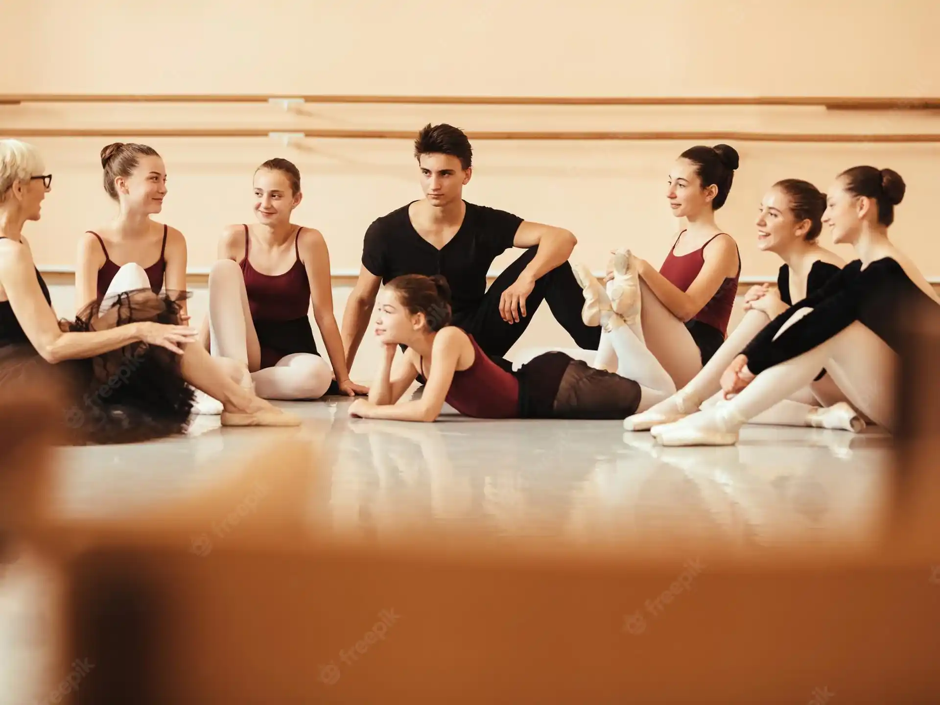 a group of people sitting on the floor