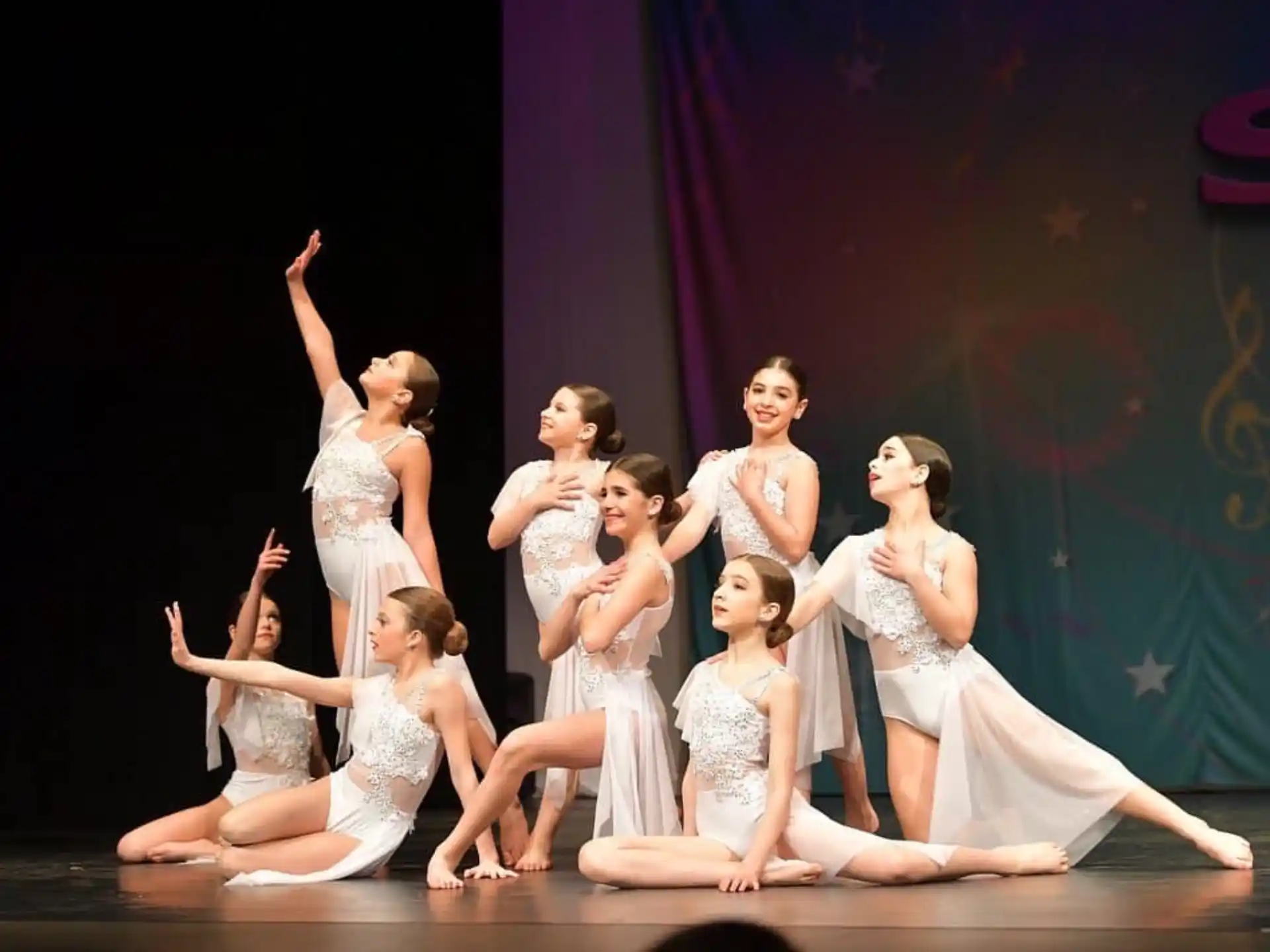 a group of women dancing on a stage
