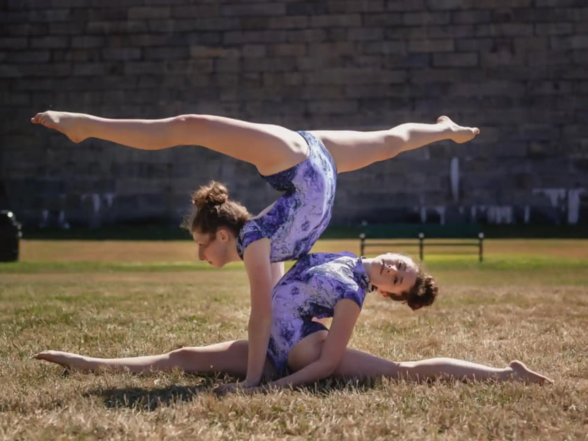 two women doing yoga