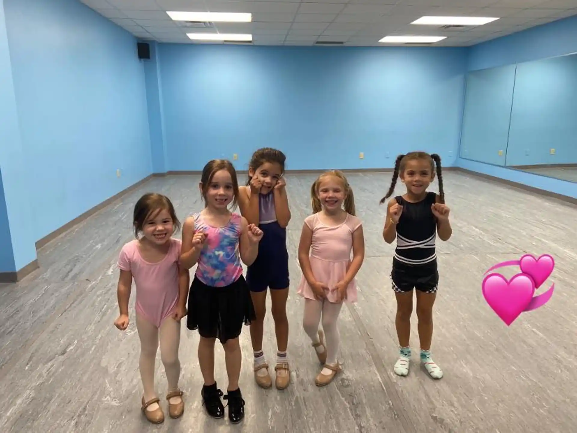 a group of girls posing for a photo