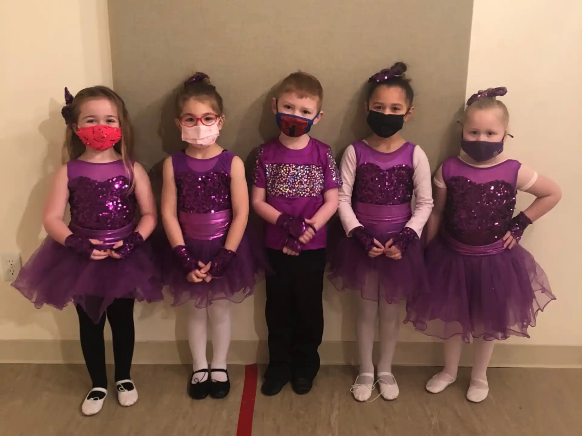 a group of girls wearing clothing