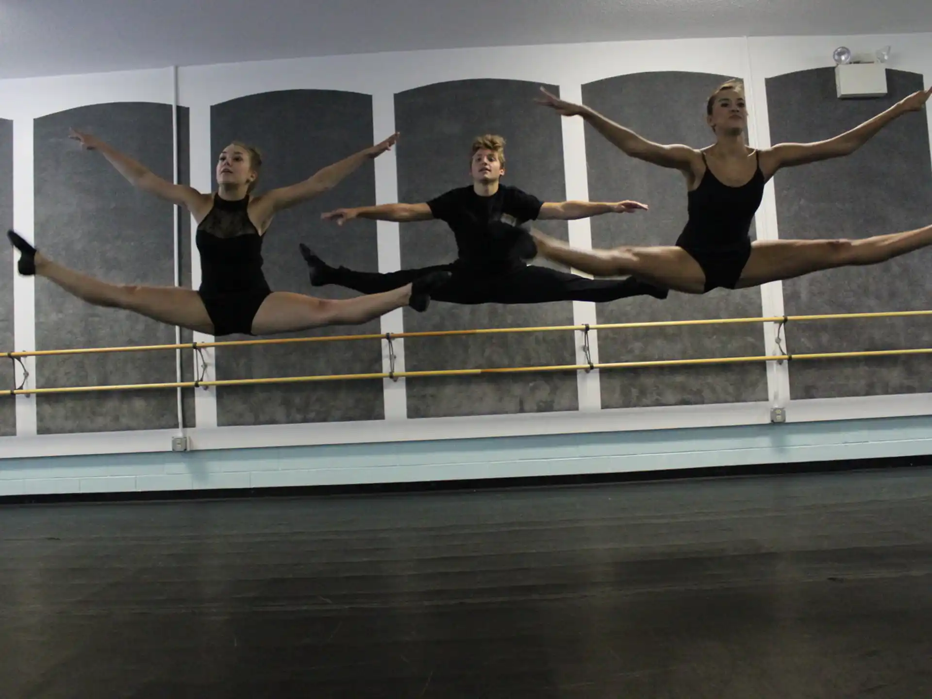 a group of people jumping in a room