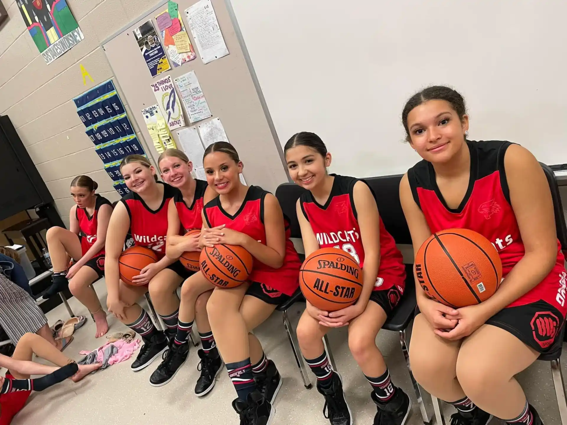 a group of women in basketball uniforms