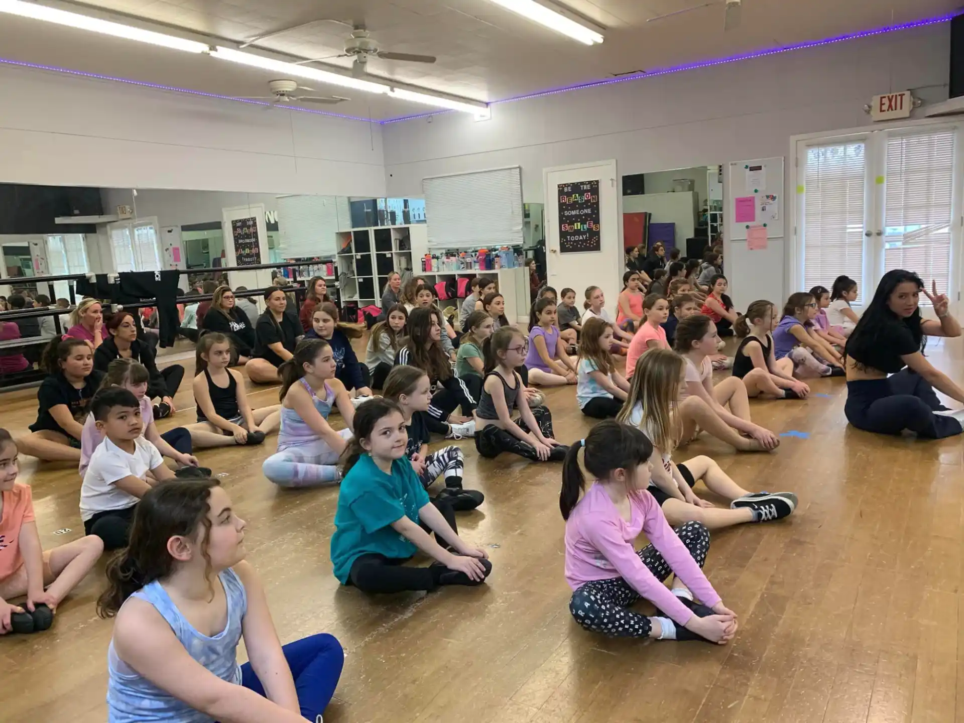 a group of people sitting on the floor