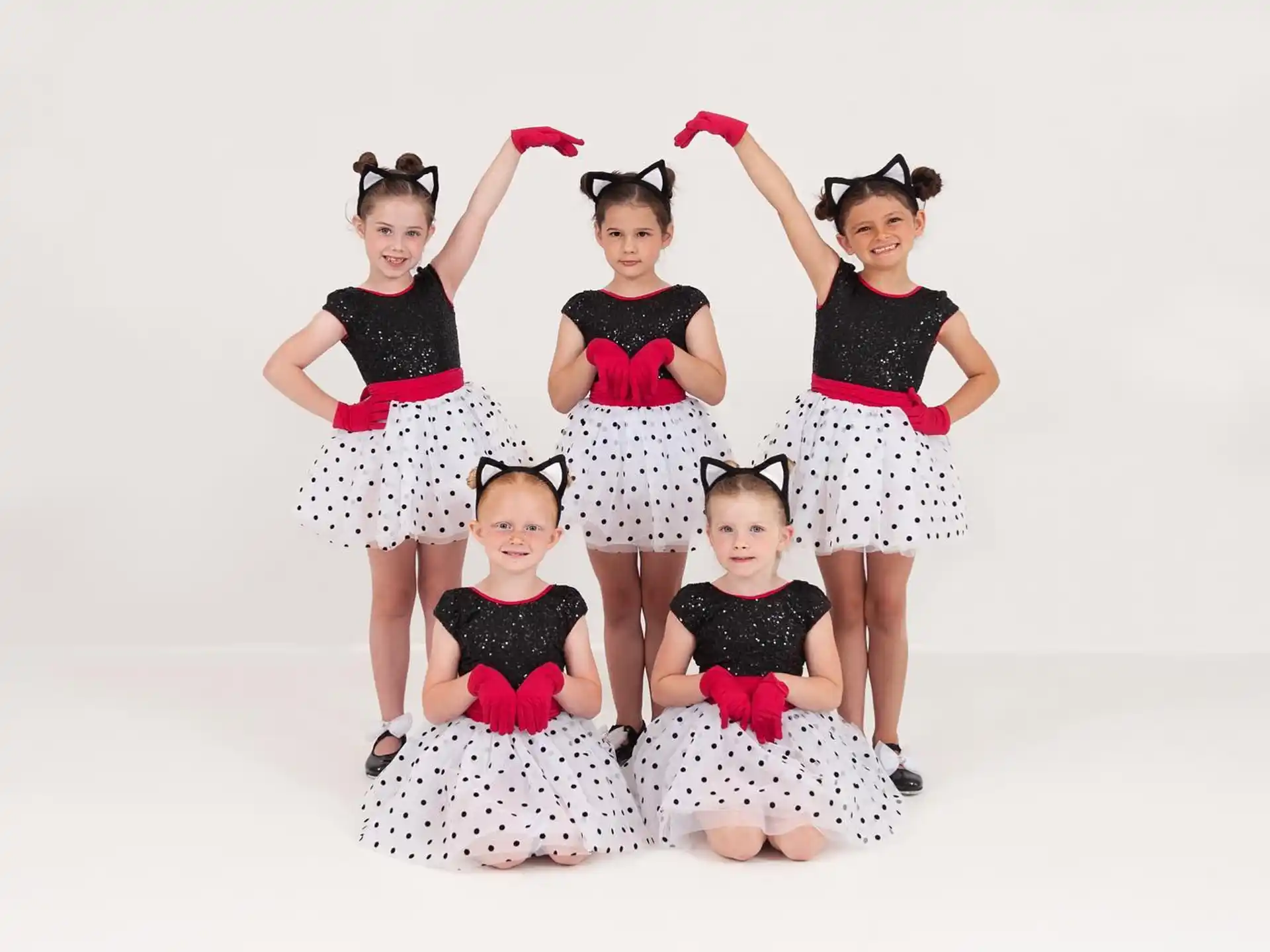 a group of girls posing for a picture